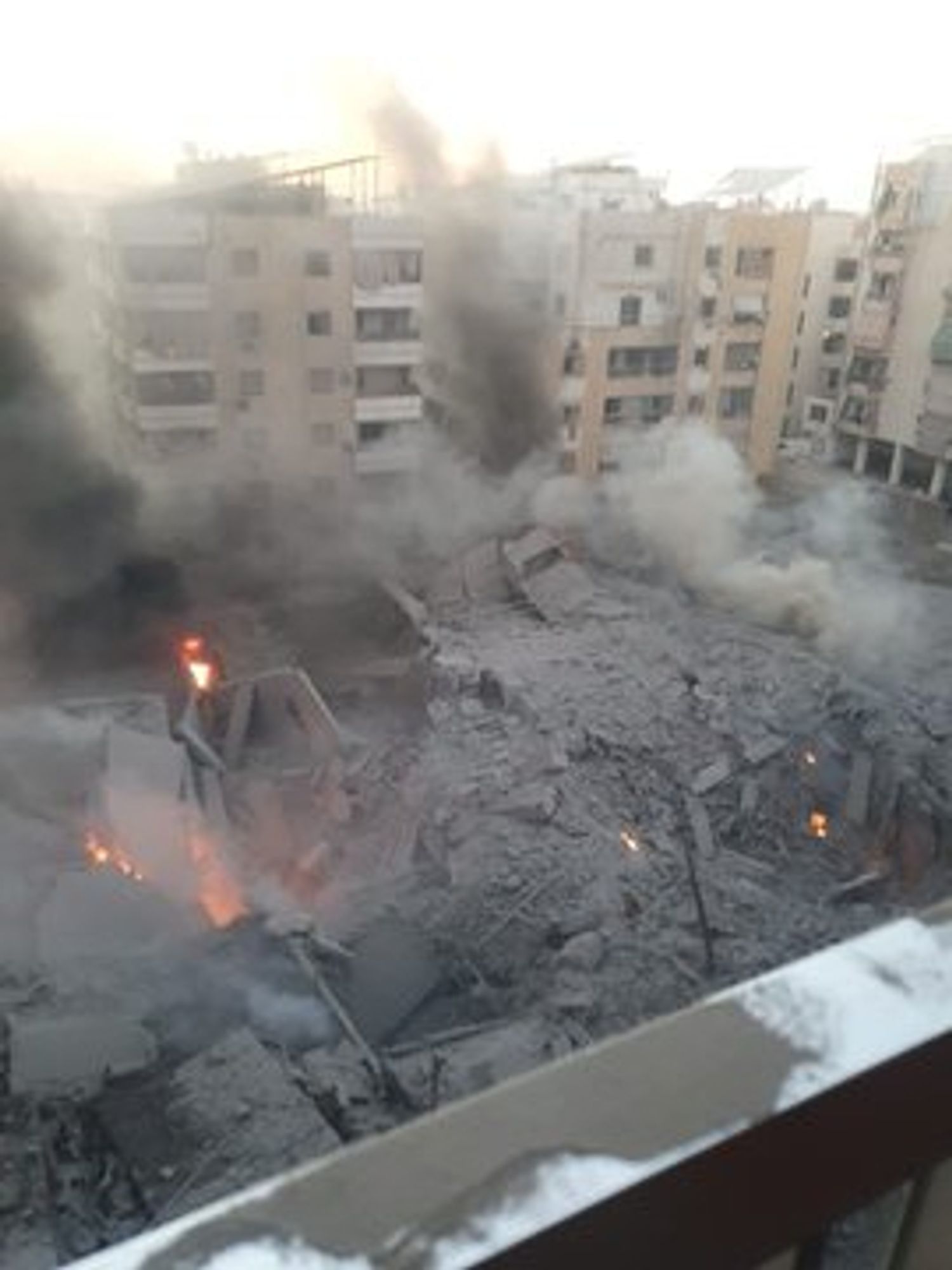 a crater in lebanon where apartment buildings used to be