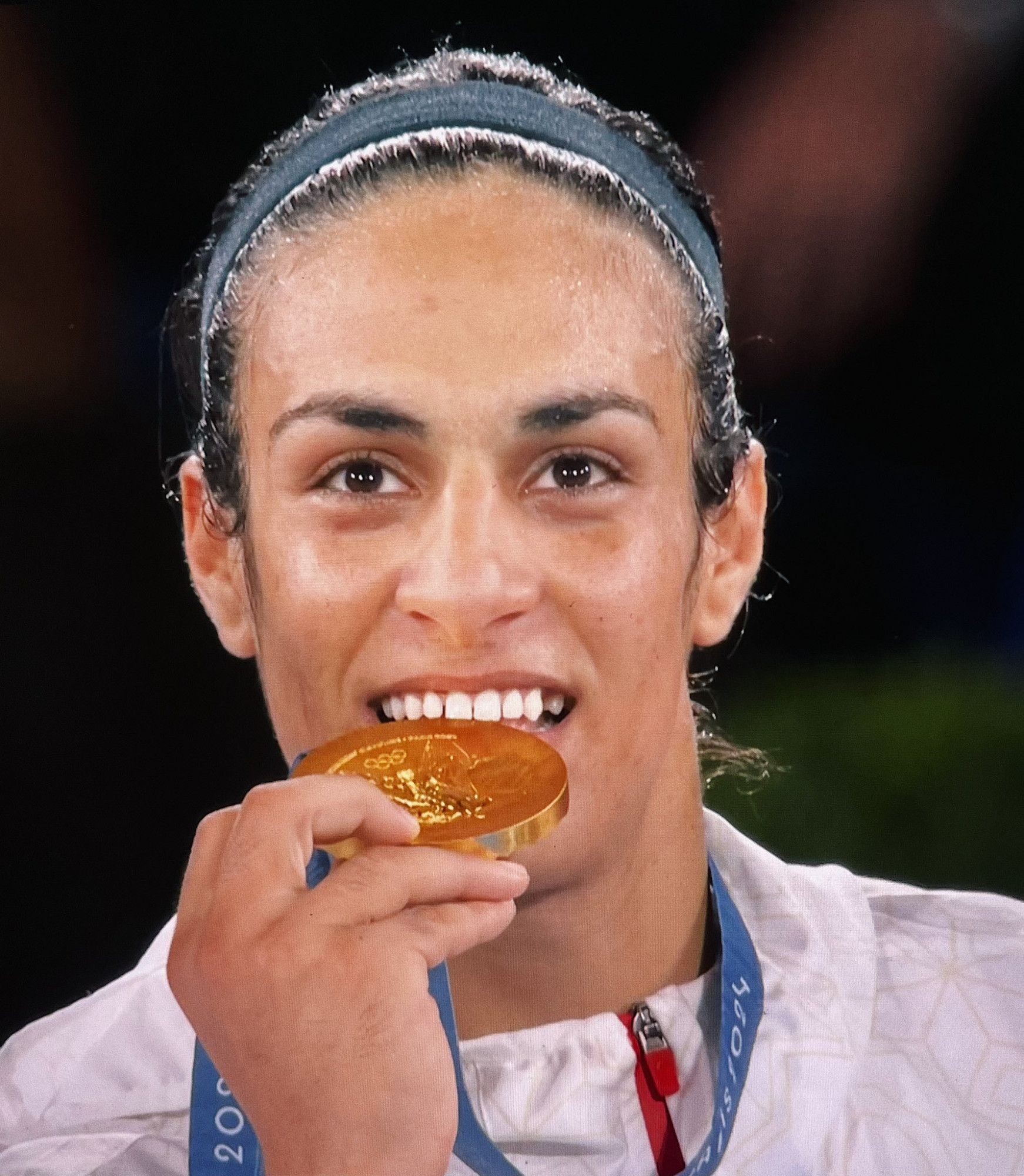 Imane biting her gold medal