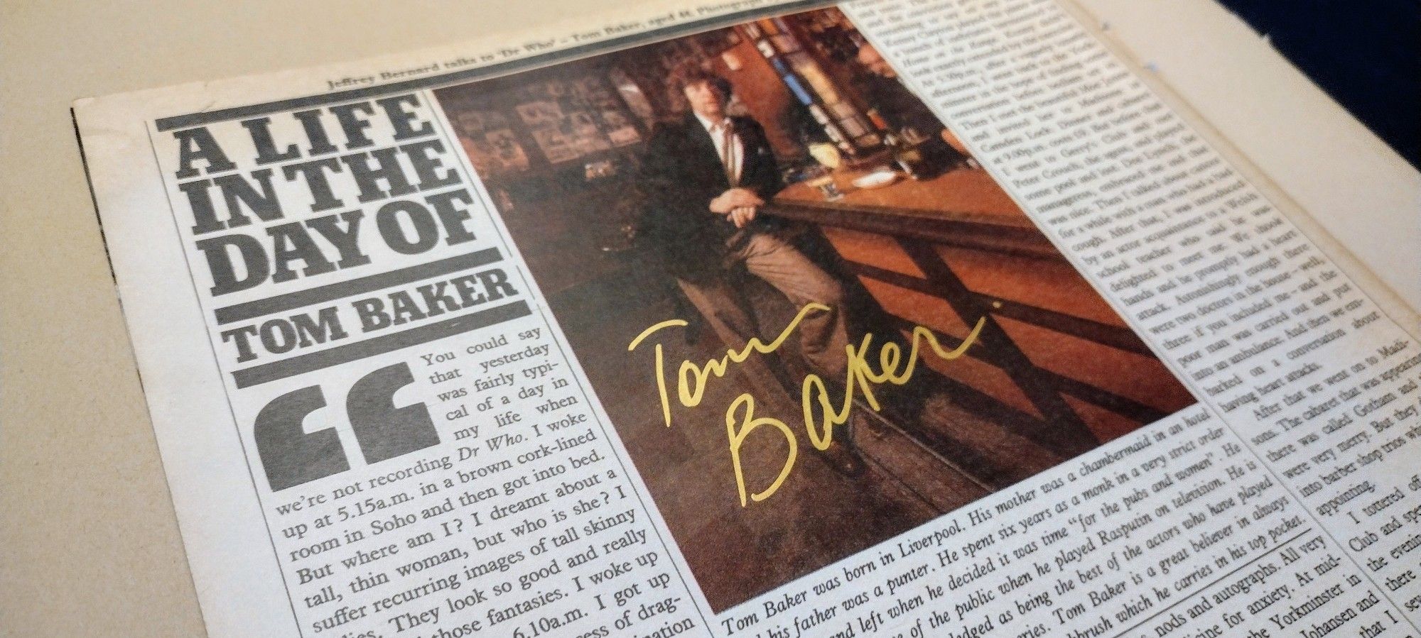 The greatest article ever written signed by Tom Baker in gold pen across his picture.