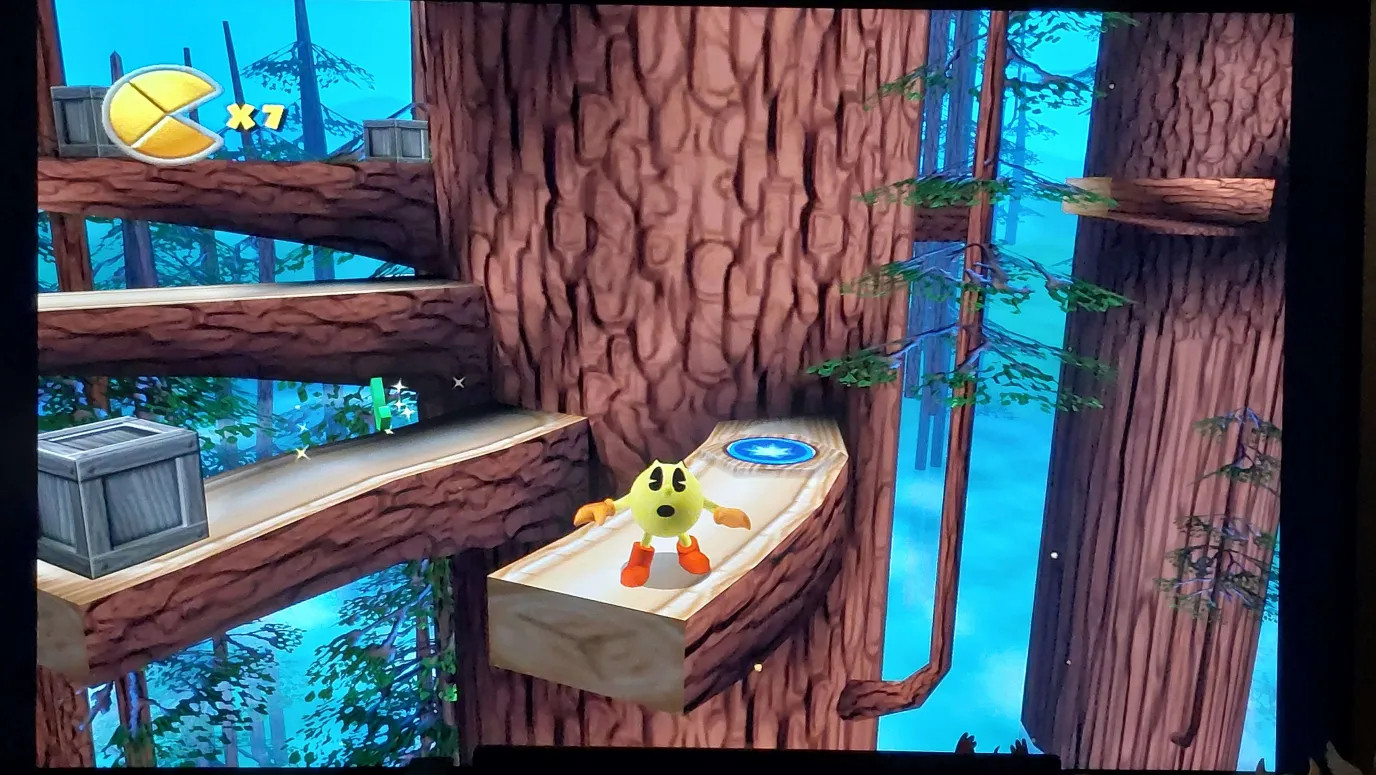 Screenshot of Pac-Man World 2 running in 4k on my tv. Pac-Man is looking around him in the forest
