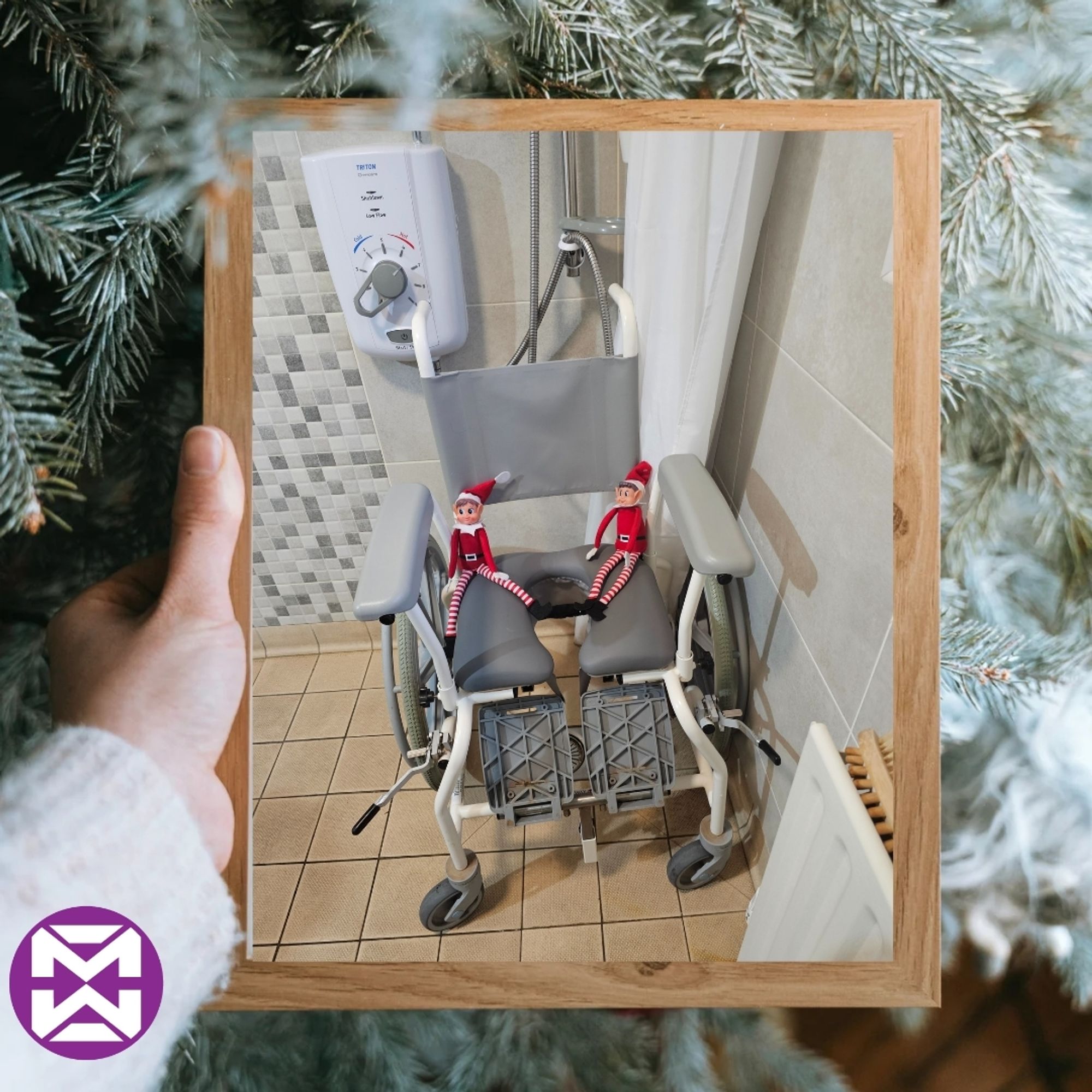 Hollywood and Sansome are in a wet room, sitting in a shower seat together.

They are framed by a close-up of a frosted Christmas tree in the background.