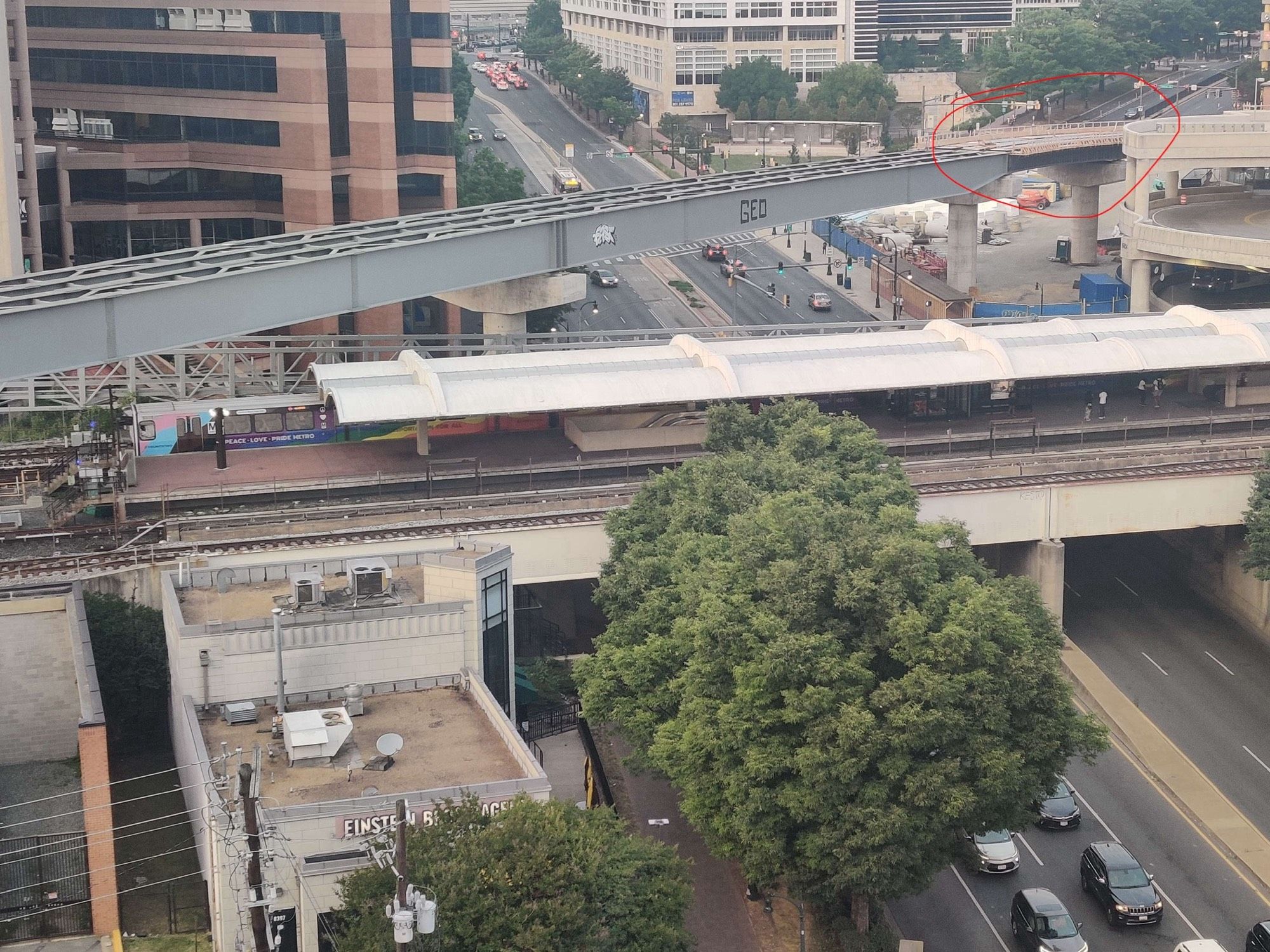 A photo of the silver spring metro station with the purple line girders above it. To the right (east) is the silver spring bus station, where I’ve circled where the purple line meets the top level of the bus station