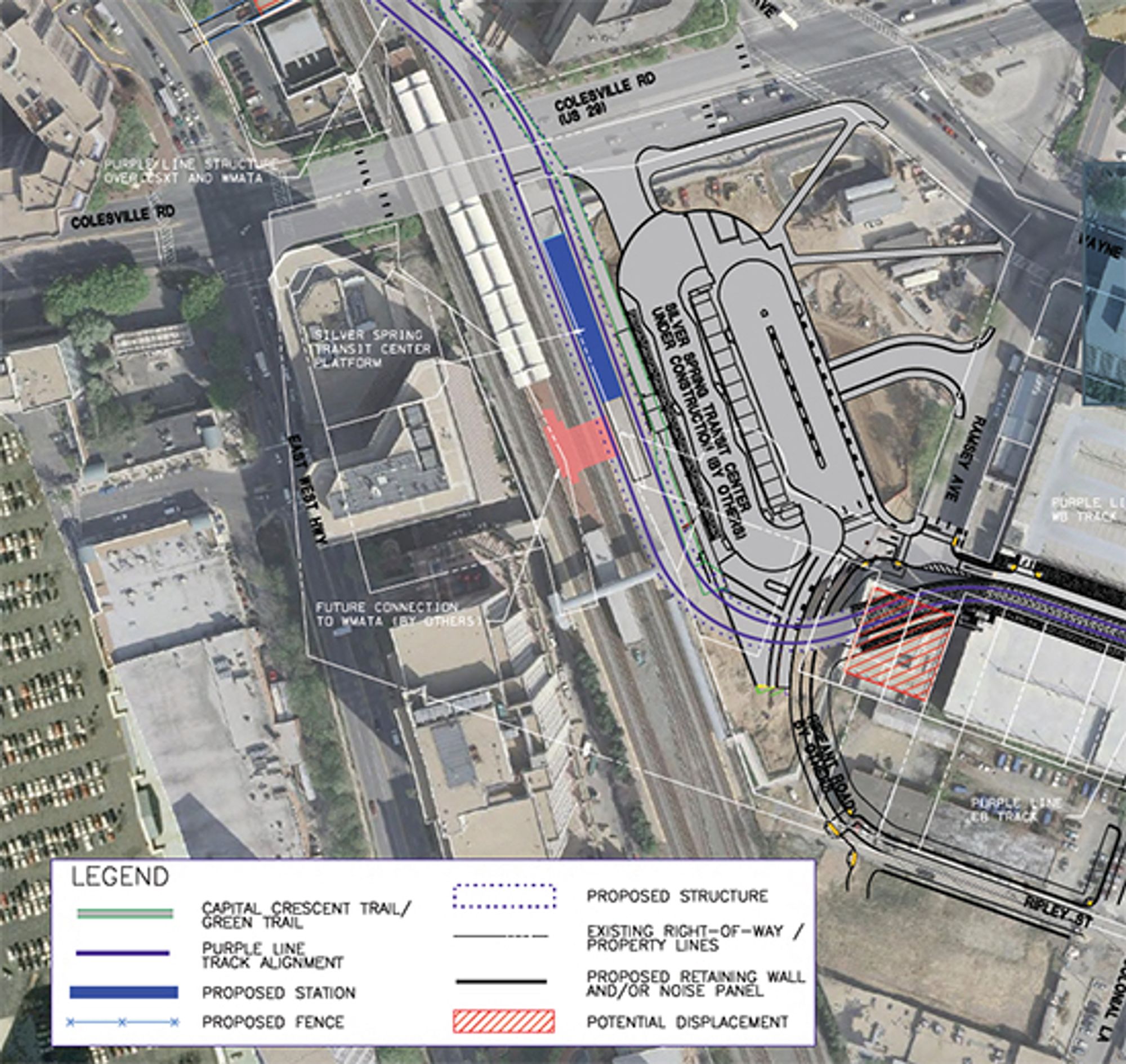 A satellite photo of the silver spring metro station, showing the proposed location of the purple line stop. It runs parallel to the red line tracks, in contrast to the photo of the line as it is shown to be constructed in the other photo.