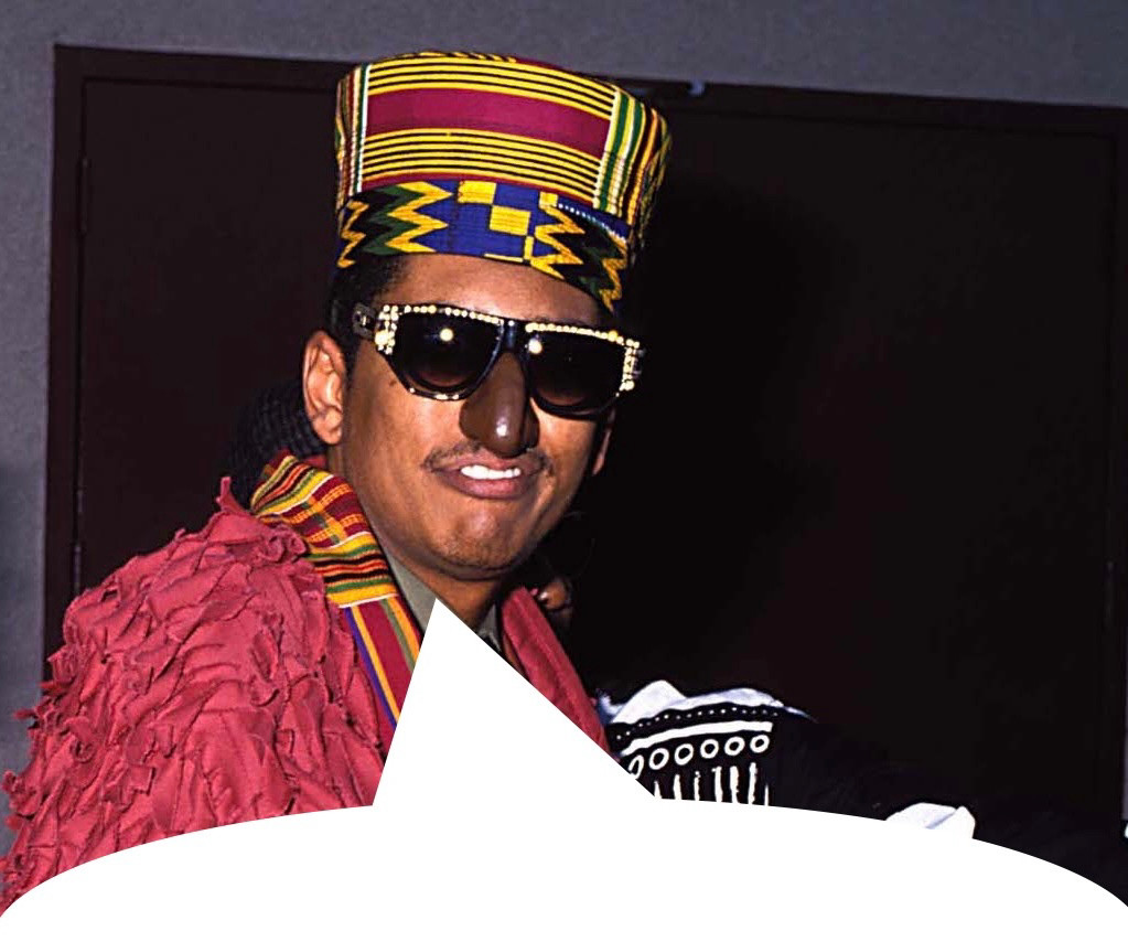 A photo of Humpty Hump of Digital Underground made to look like he is saying the quoted skeet. In the song “The Humpty Dance” he says he likes his oatmeal lumpy. Humpty Hump is wearing a fake nose, sunglasses, and a sort of African hat. 