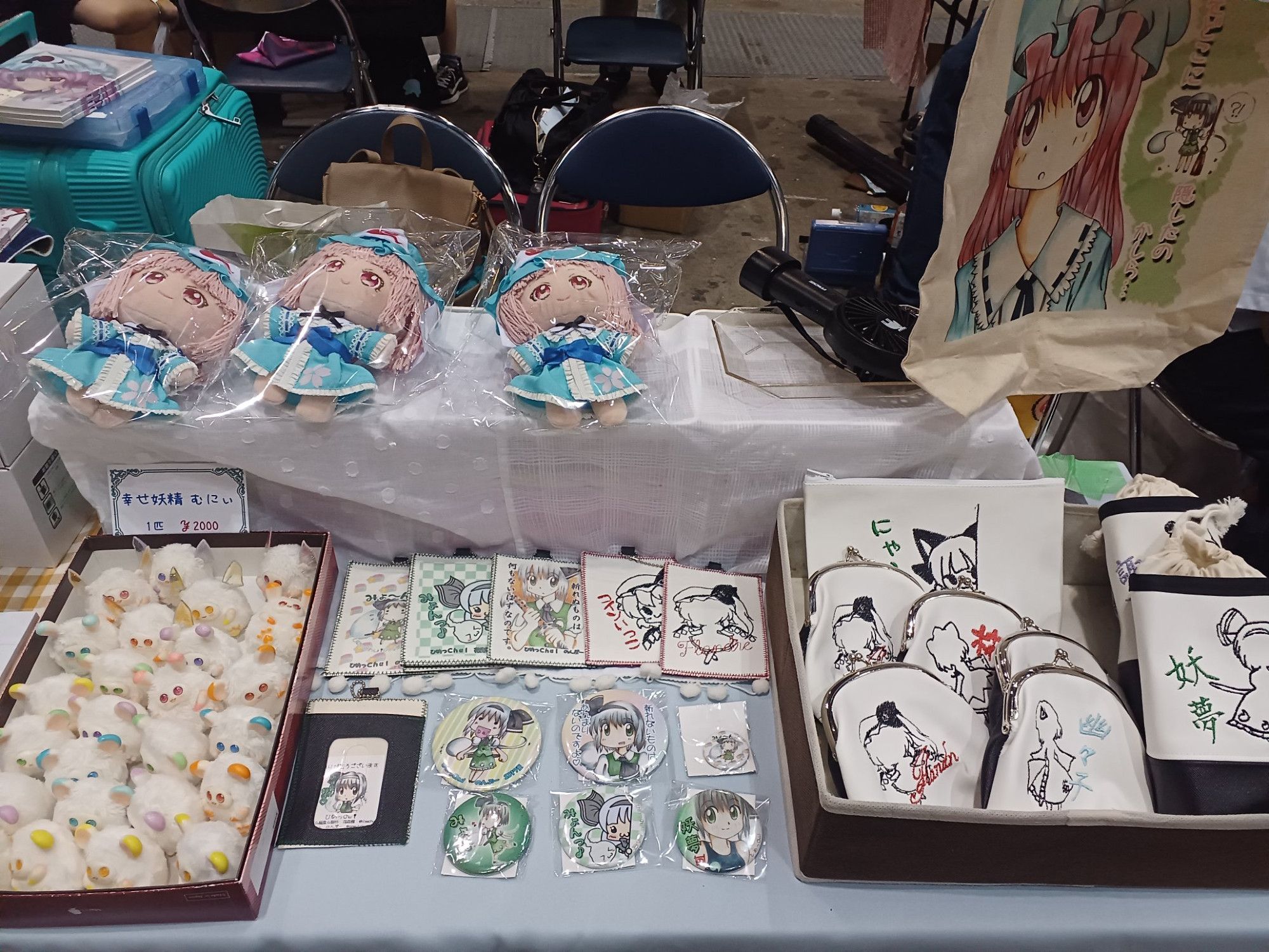 An image of the sellers setup at Comiket 104 showing what they had on sale.