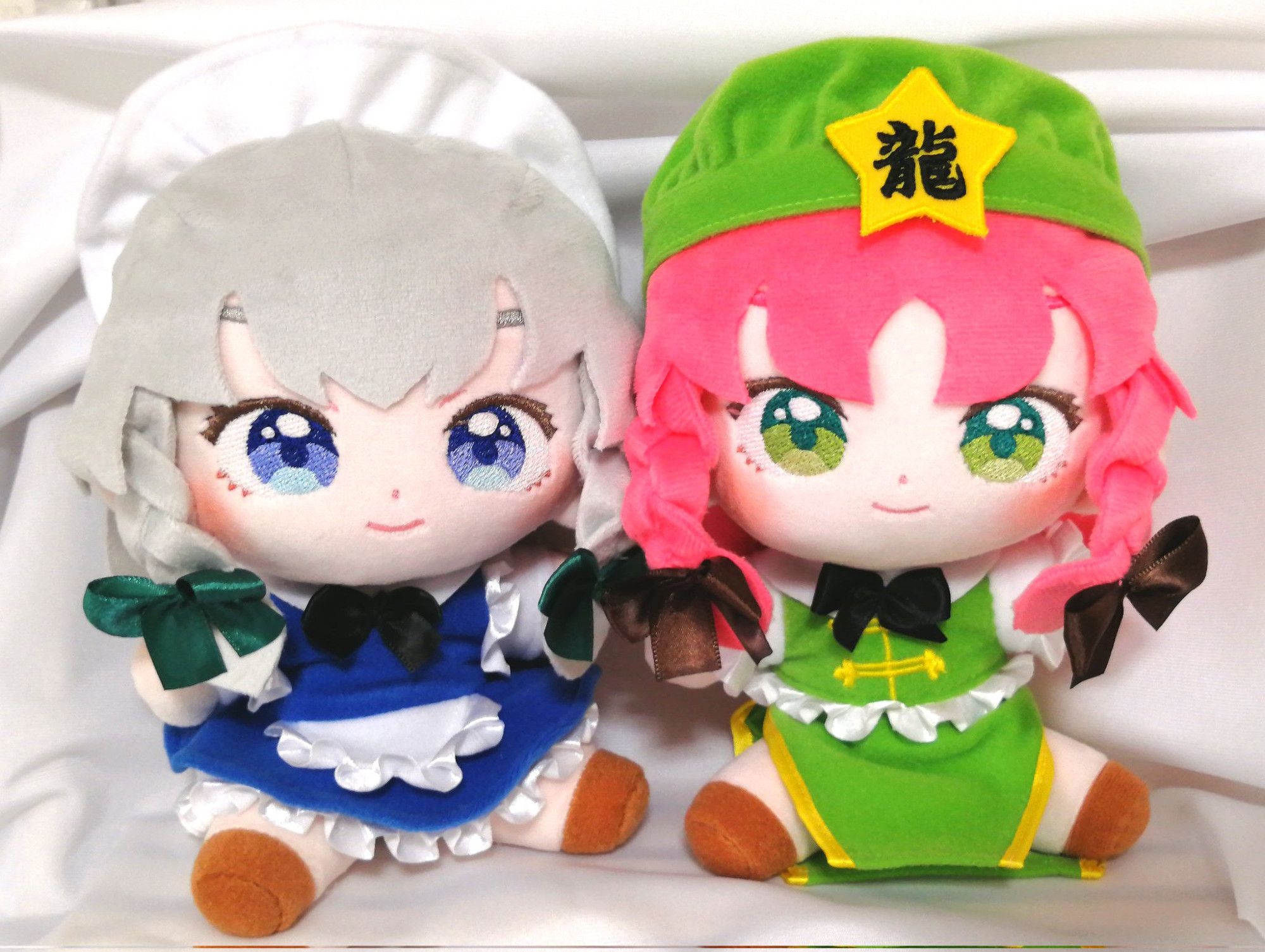 2 handmade stuffed toys of Sakuya and Meiling from the Touhou Project franchise.