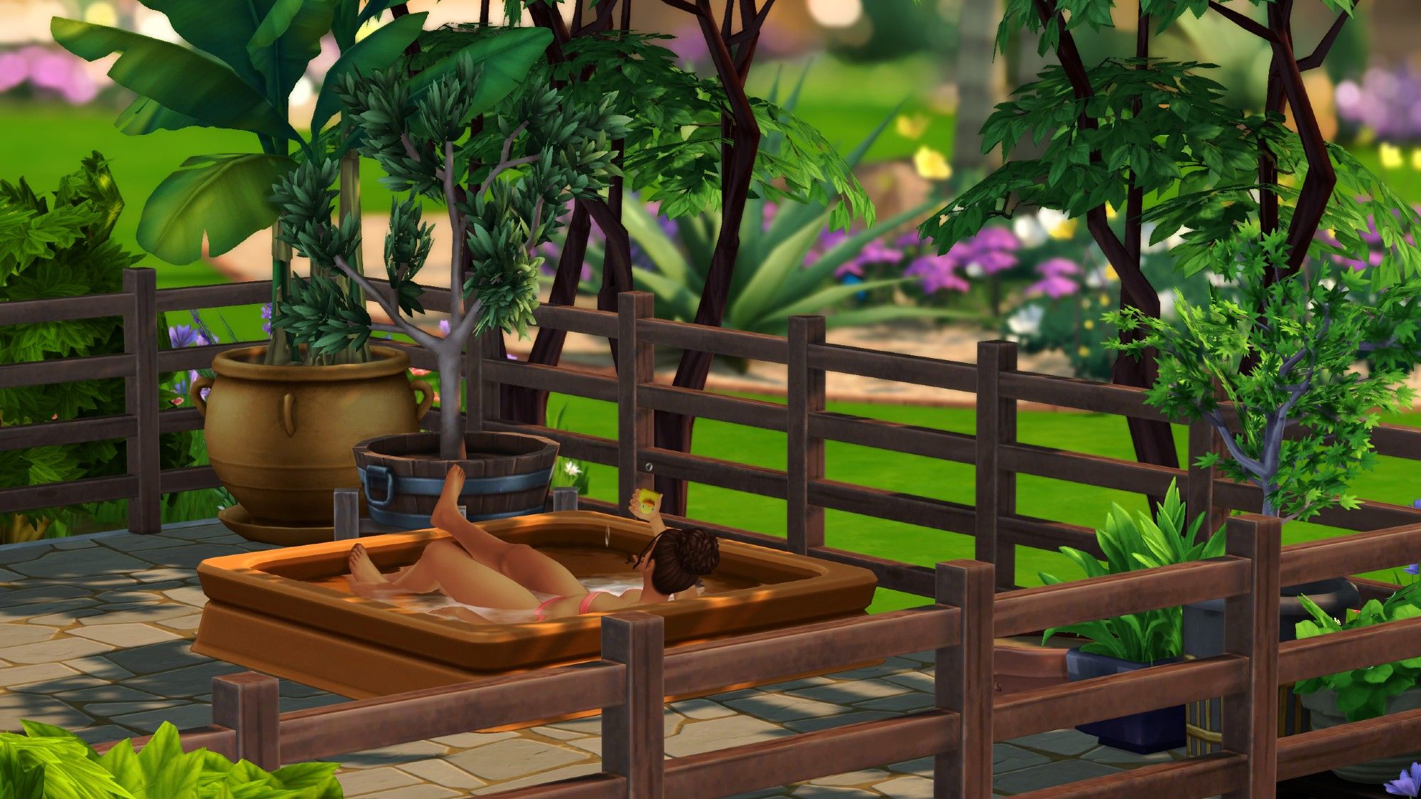 Adult sim lounging in a kiddie pool.