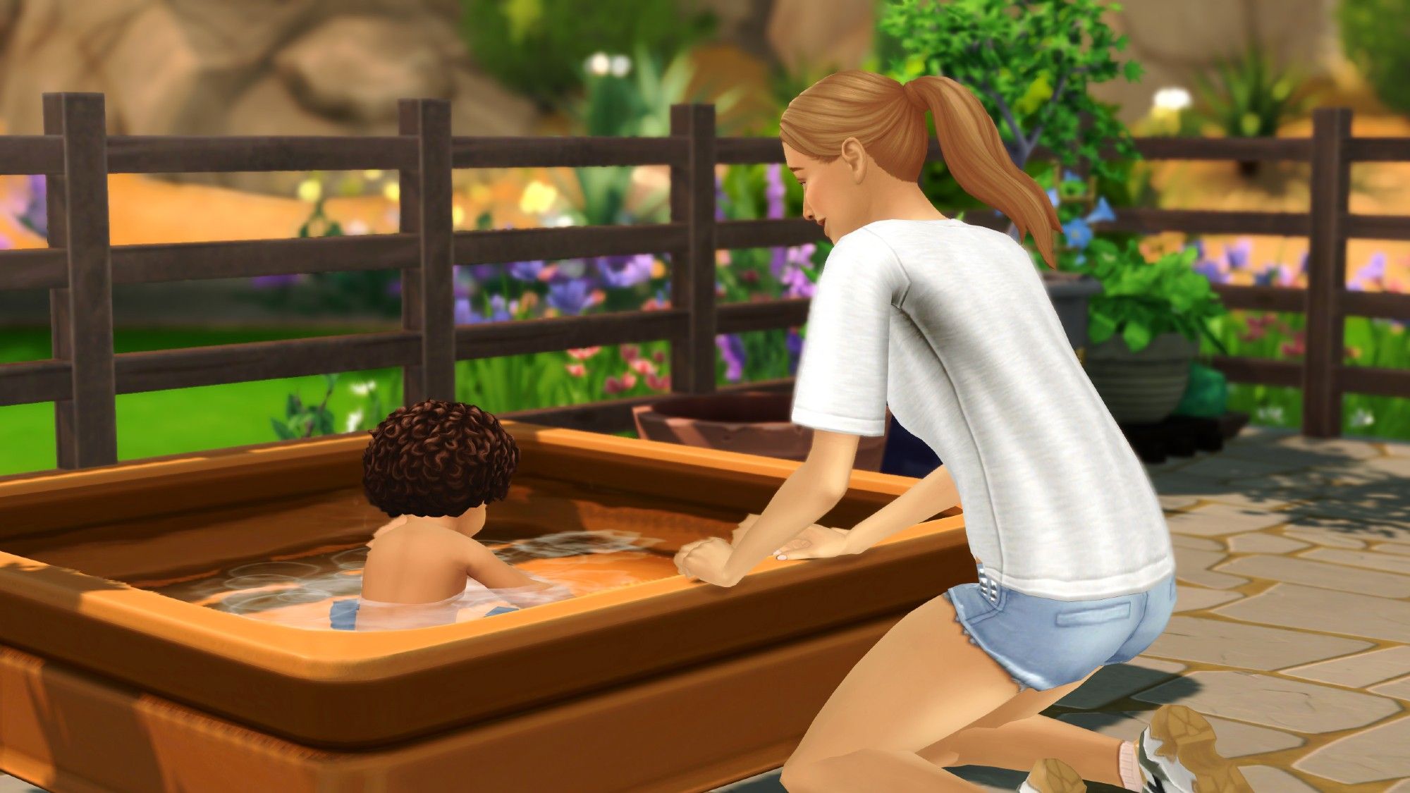 Adult sim watches over a toddler in a kiddie pool.