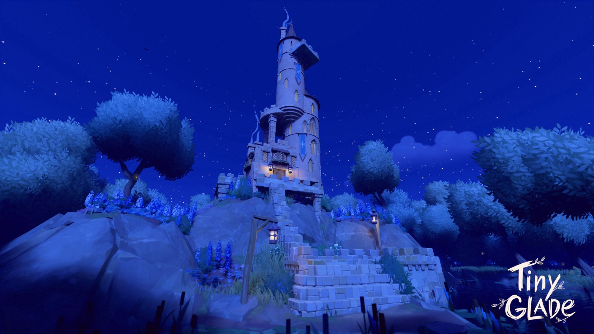 Nighttime at the tower. The moonlight bathes the hillside in soft blues while lanterns light your way up the staircase