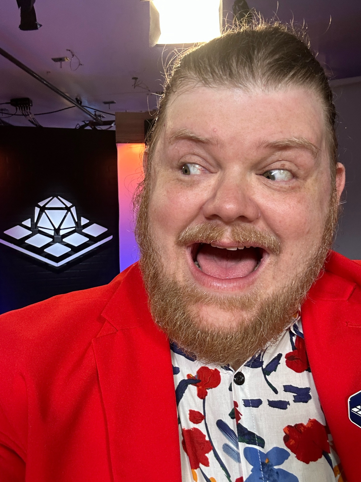 Ron Ogden’s Huge Grin in front of the Tabletop News logo.