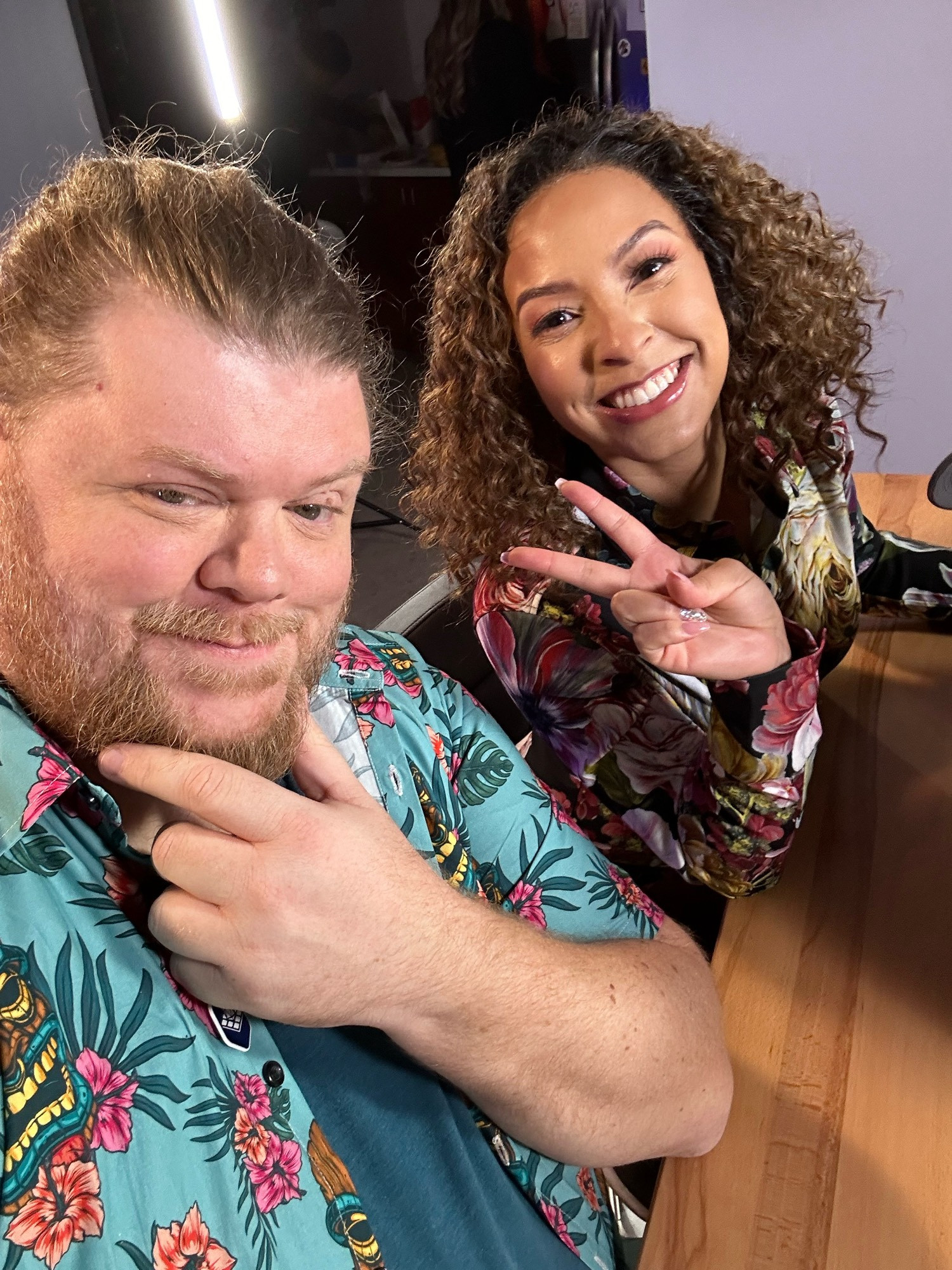 Ron Ogden and Breanna DeCoster smiling for the camera before they host the desk in Ep 103!