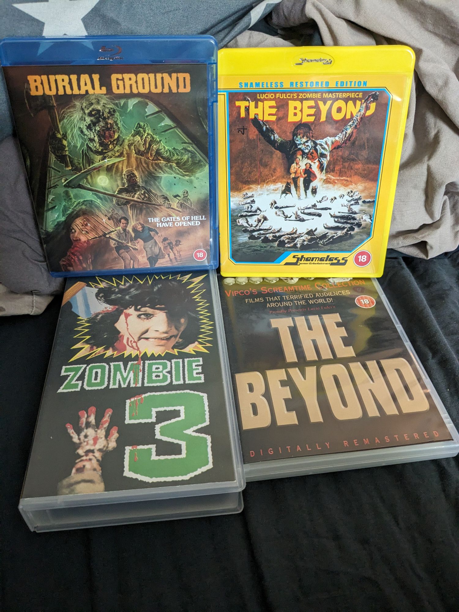 newly restored Burial Ground on blu-ray and an old vhs, newly restored The Beyond on blu-ray and an old Vipco dvd