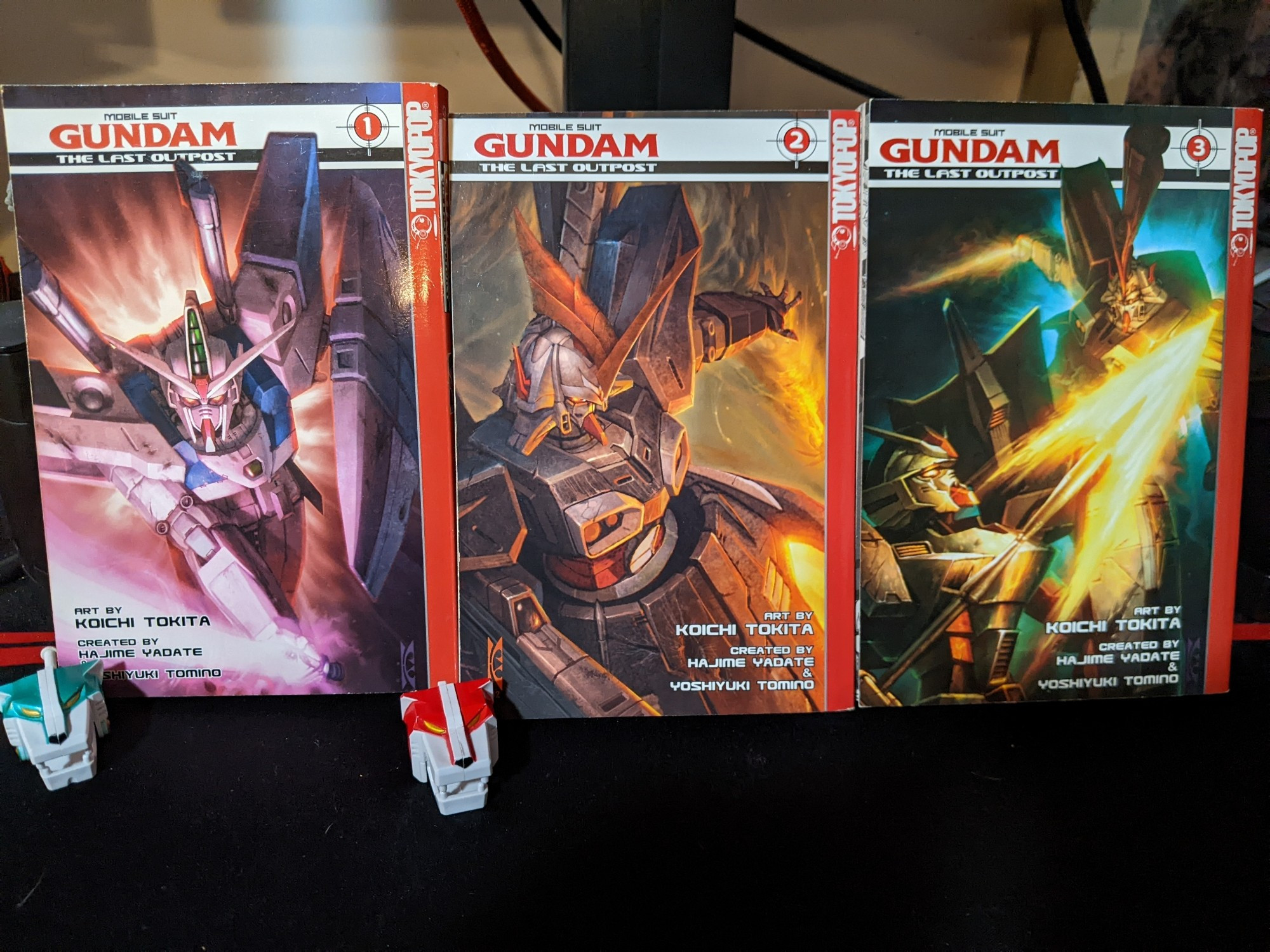 All three volumes of Mobile Suit Gundam The Last Outpost manga. A spin-off of Gundam Wing.