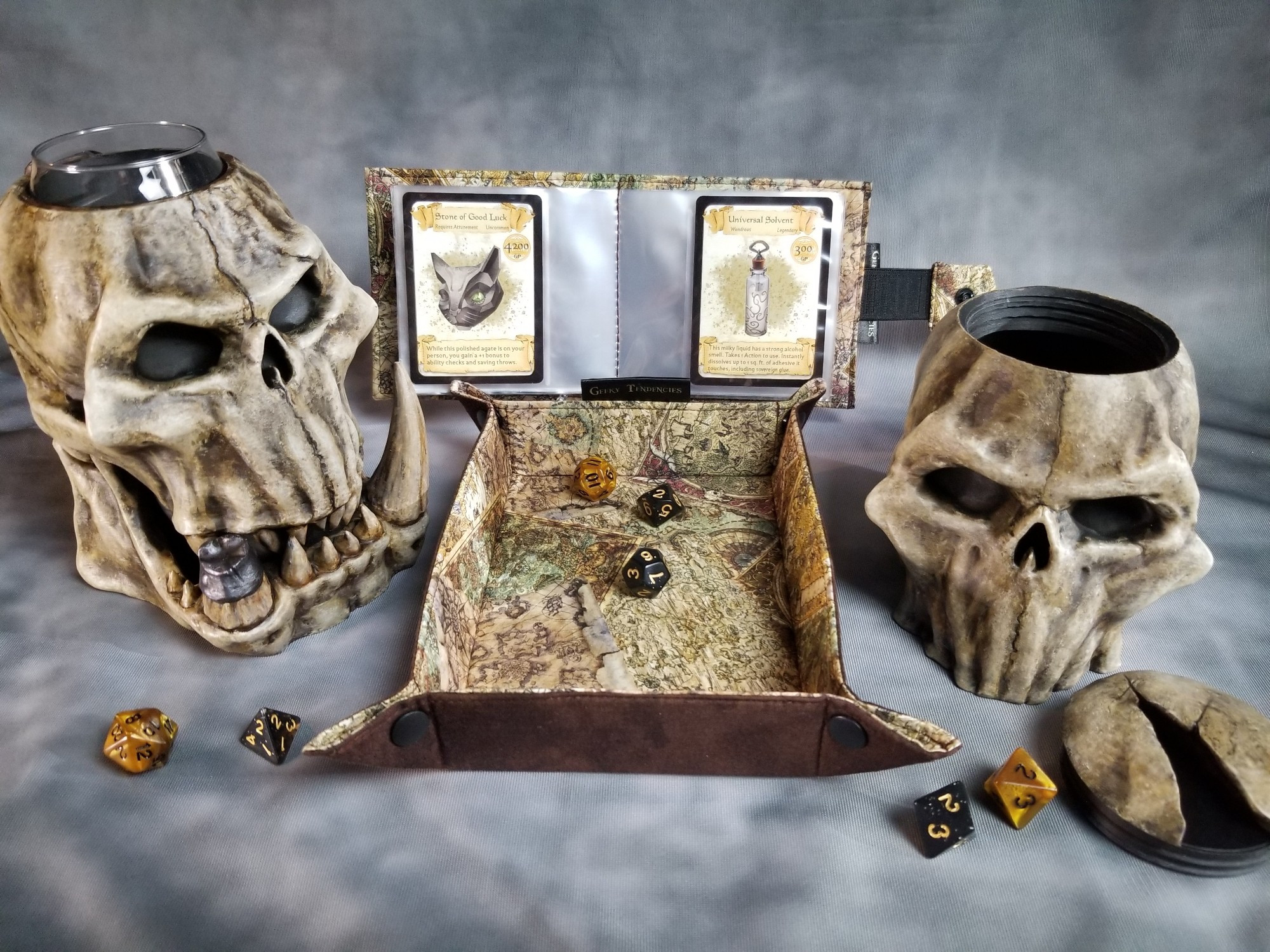 Orc skull mythic mug can holder and skull dice box. Fantasy map dice tray and card album.