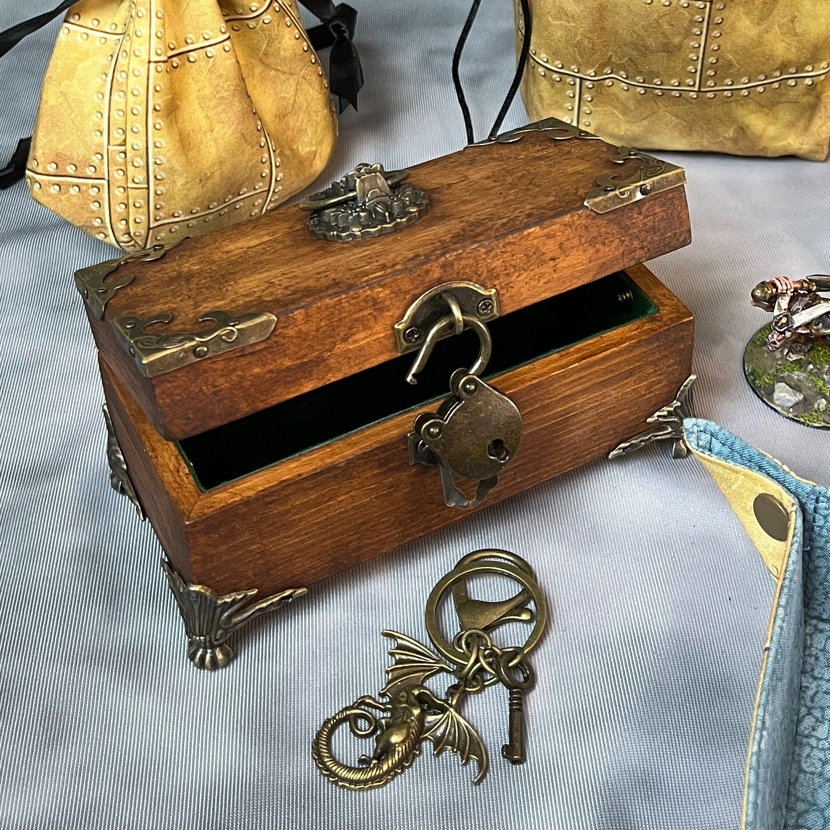 Antique brown dice vault with green felt lining and antique brass hardware