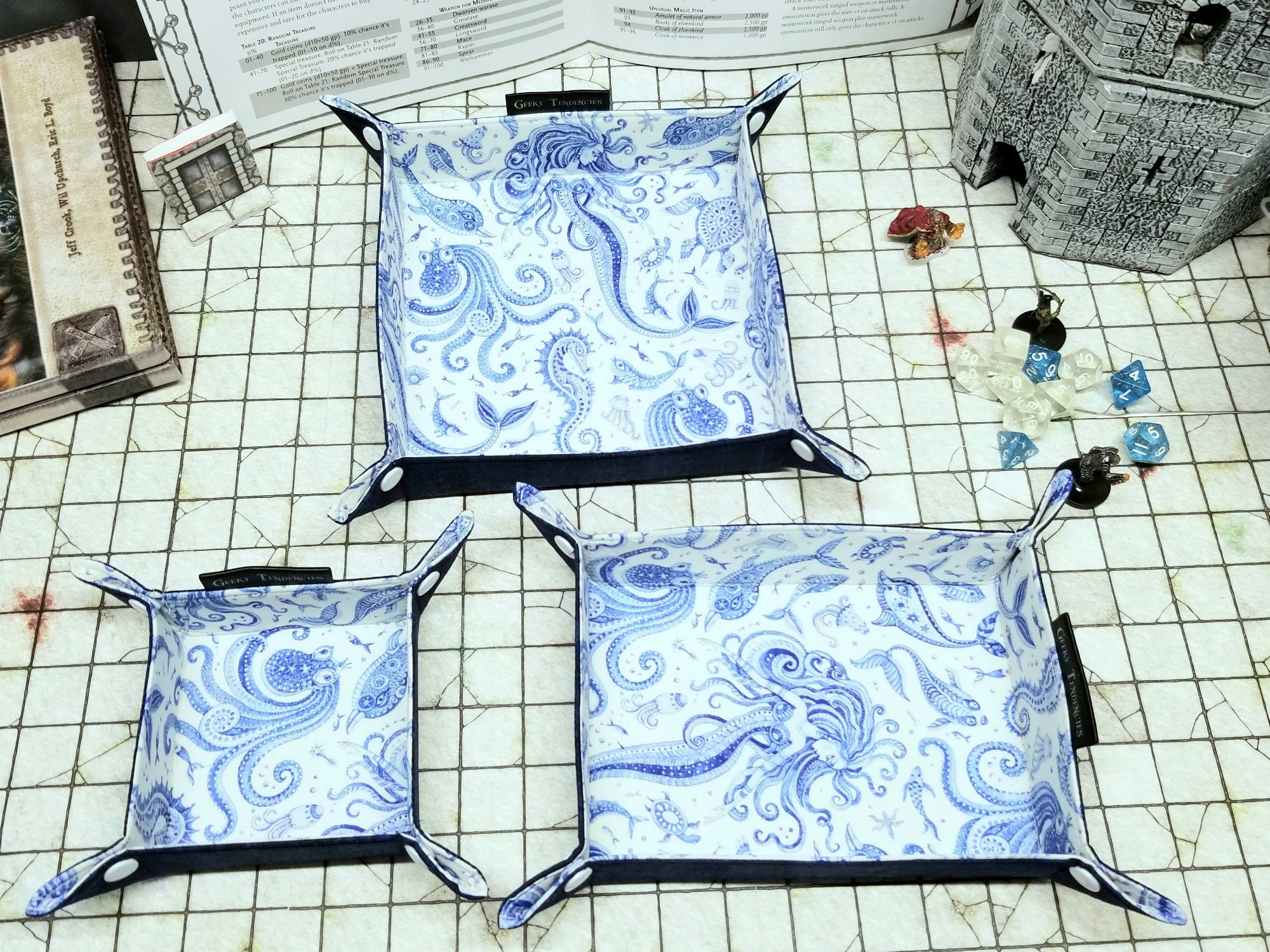 3 sizes of blue porcelain style mermaid print dice trays on a Battlemap grid. Small, medium and large.