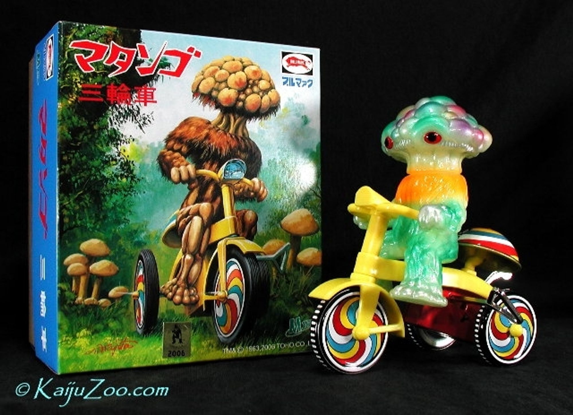 Sofubi of a Matango on a psychedelic bicycle