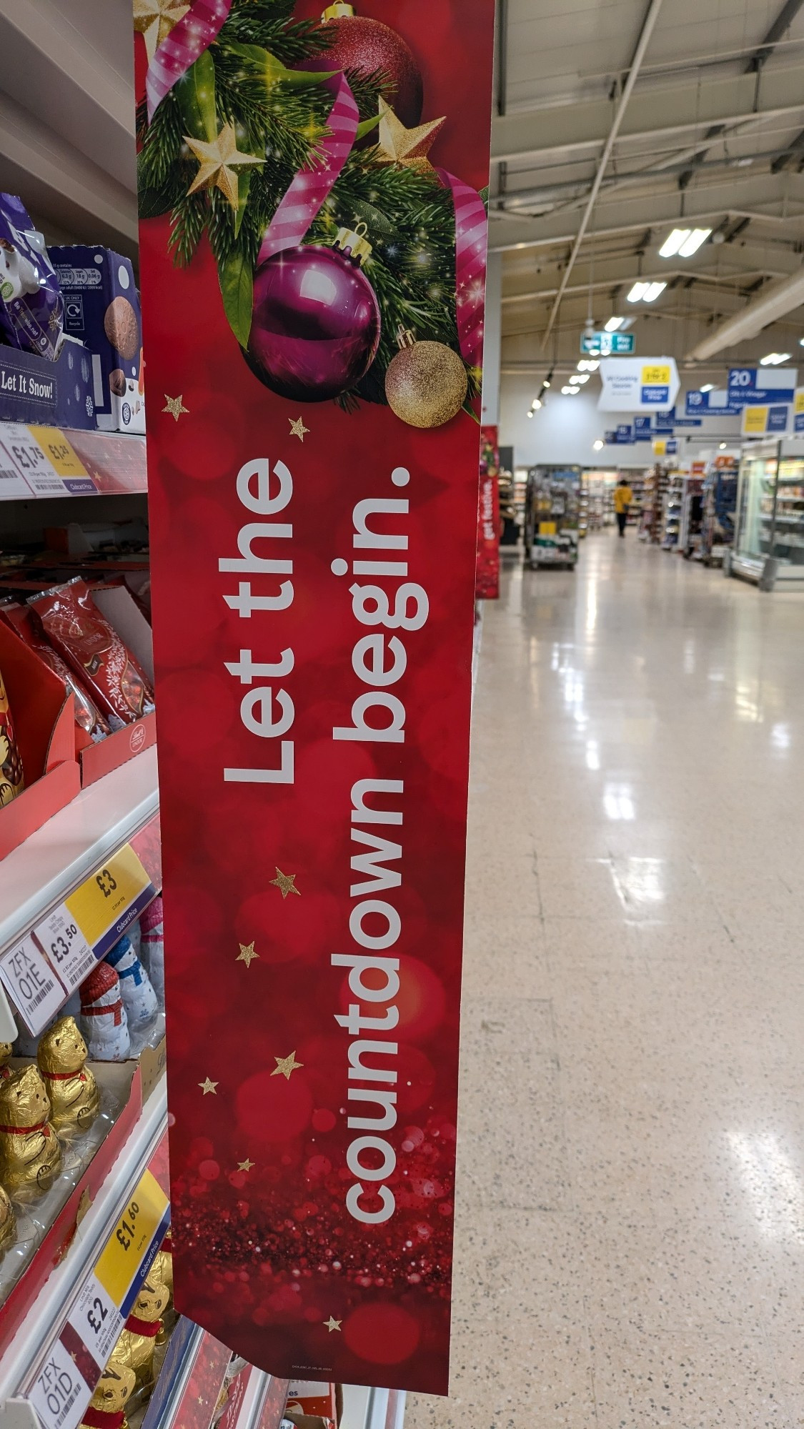 A Christmas themed sign in Tesco saying "let the countdown begin"