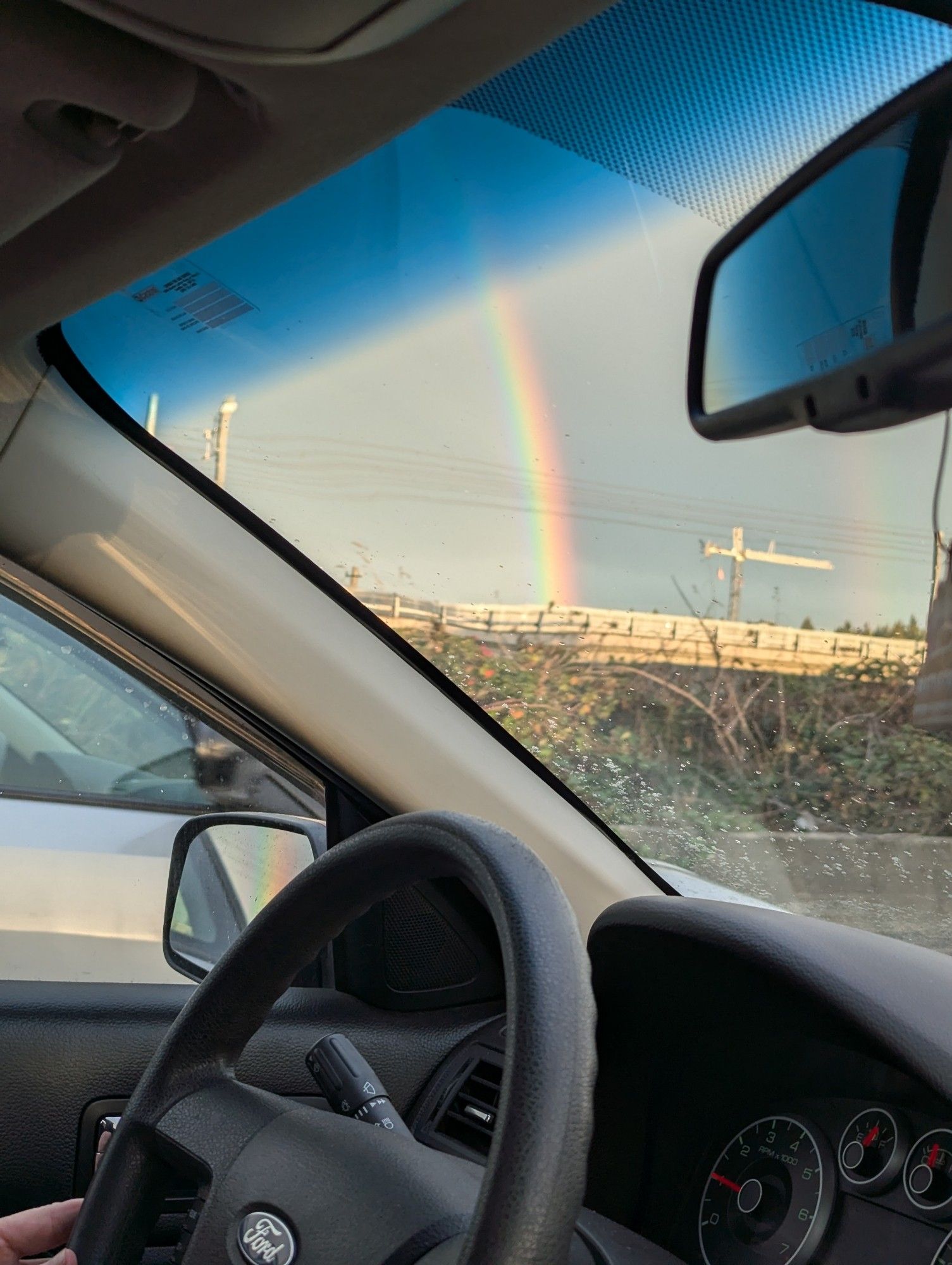 Car window and a rainbow.