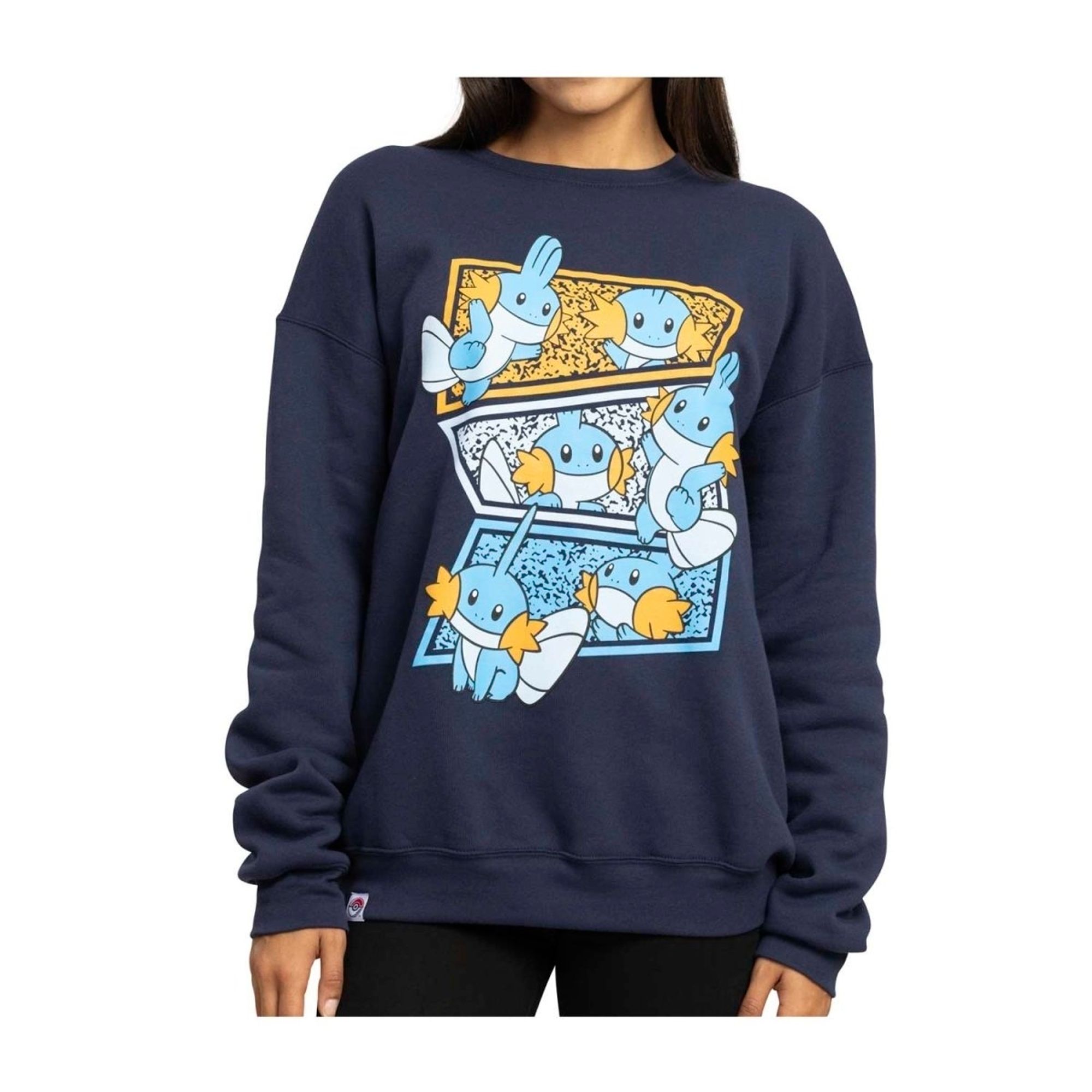 A product photo of a newly released 'Mudkip Multiplied' sweatshirt by Pokemon Center, with a design featuring six of the starter Pokemon Mudkip in different poses