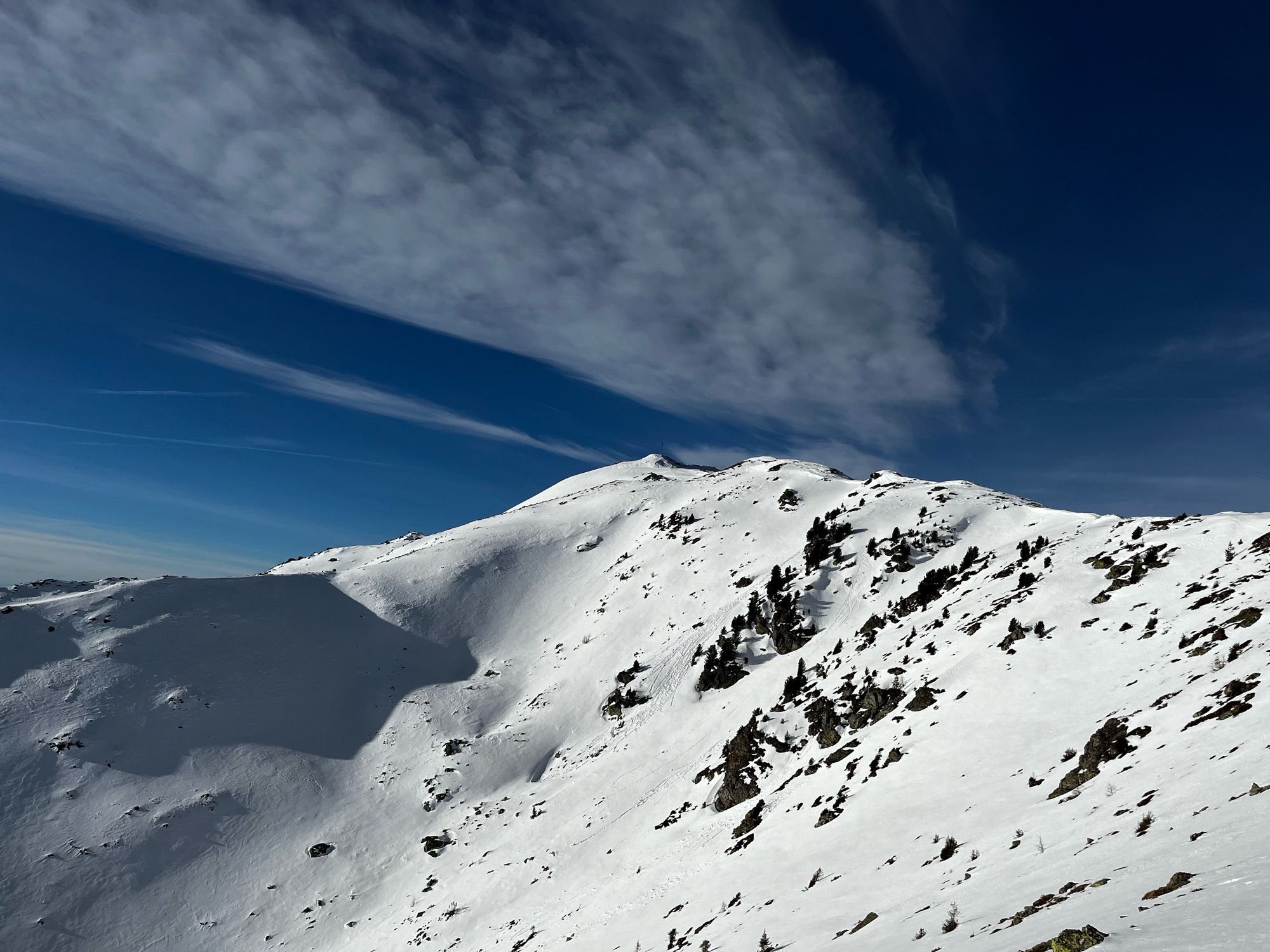 A glimpse of the Königsangerspitze peak. Majestic view of the untouched snow covered ridge line