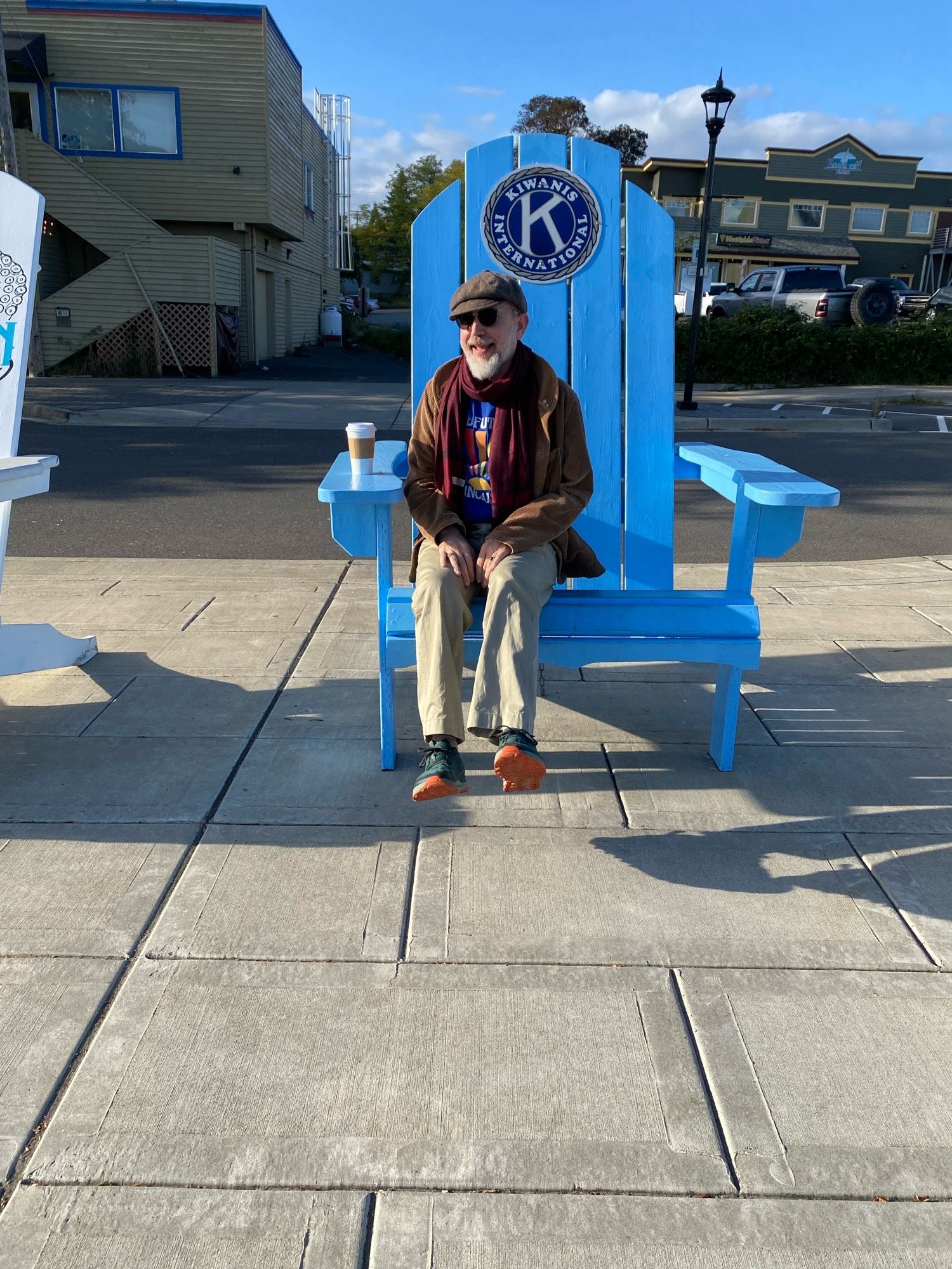 tiny Sean, enormous blue Adirondack chair, a-la Edith Ann