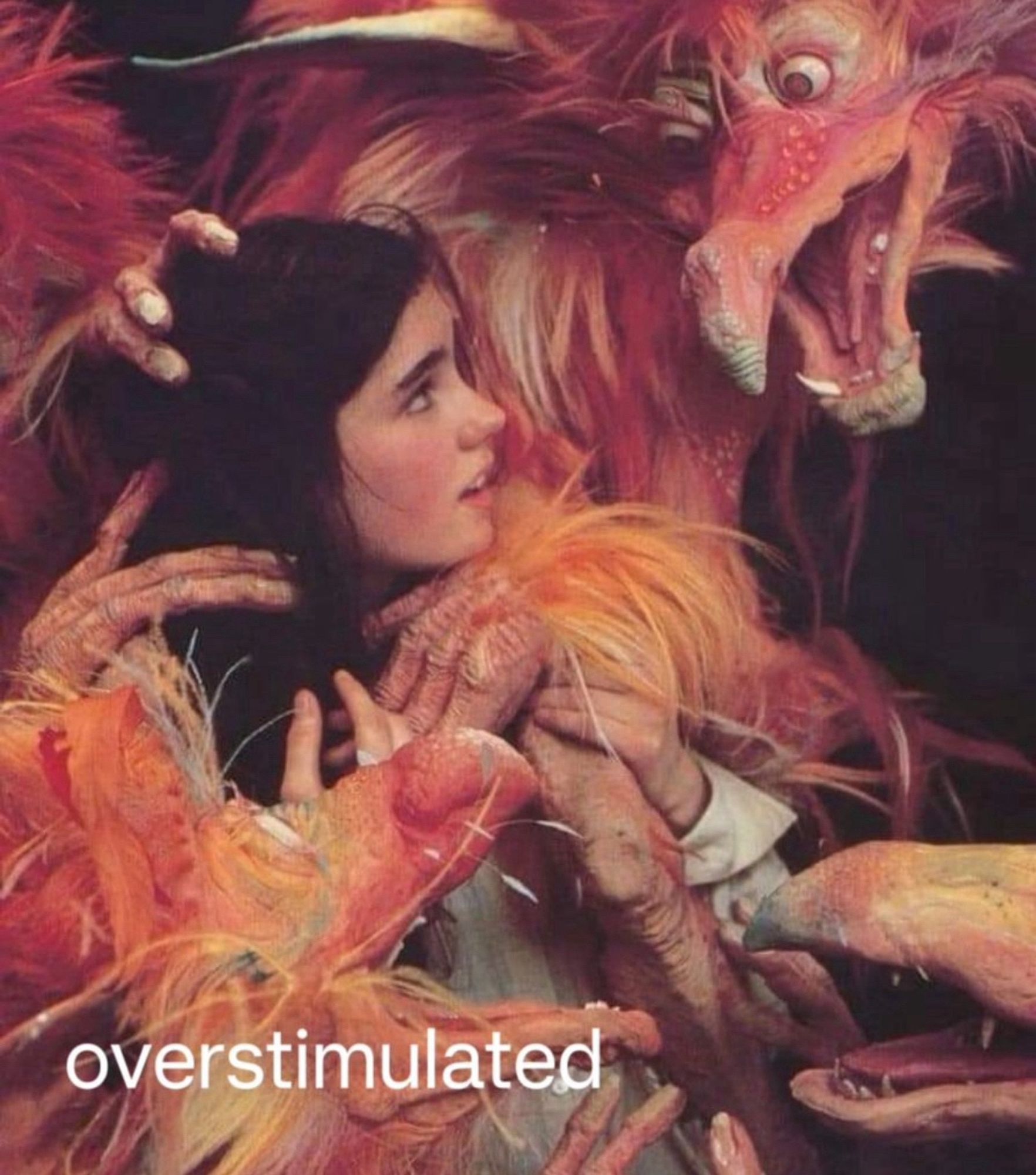 Sarah in Labyrinth surrounded by the Fireys

text reads 

“overstimulated”