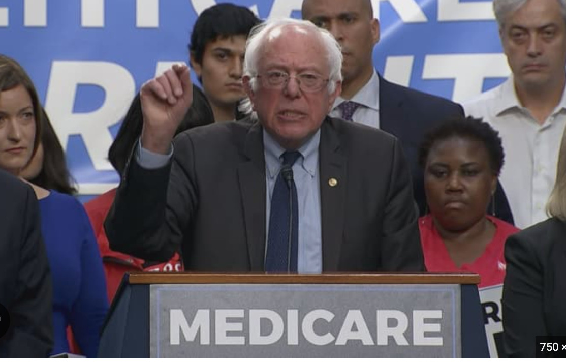 corey booker hiding behind bernie while pretending to support medicare4alll and staring hard to disappear into nothingness.