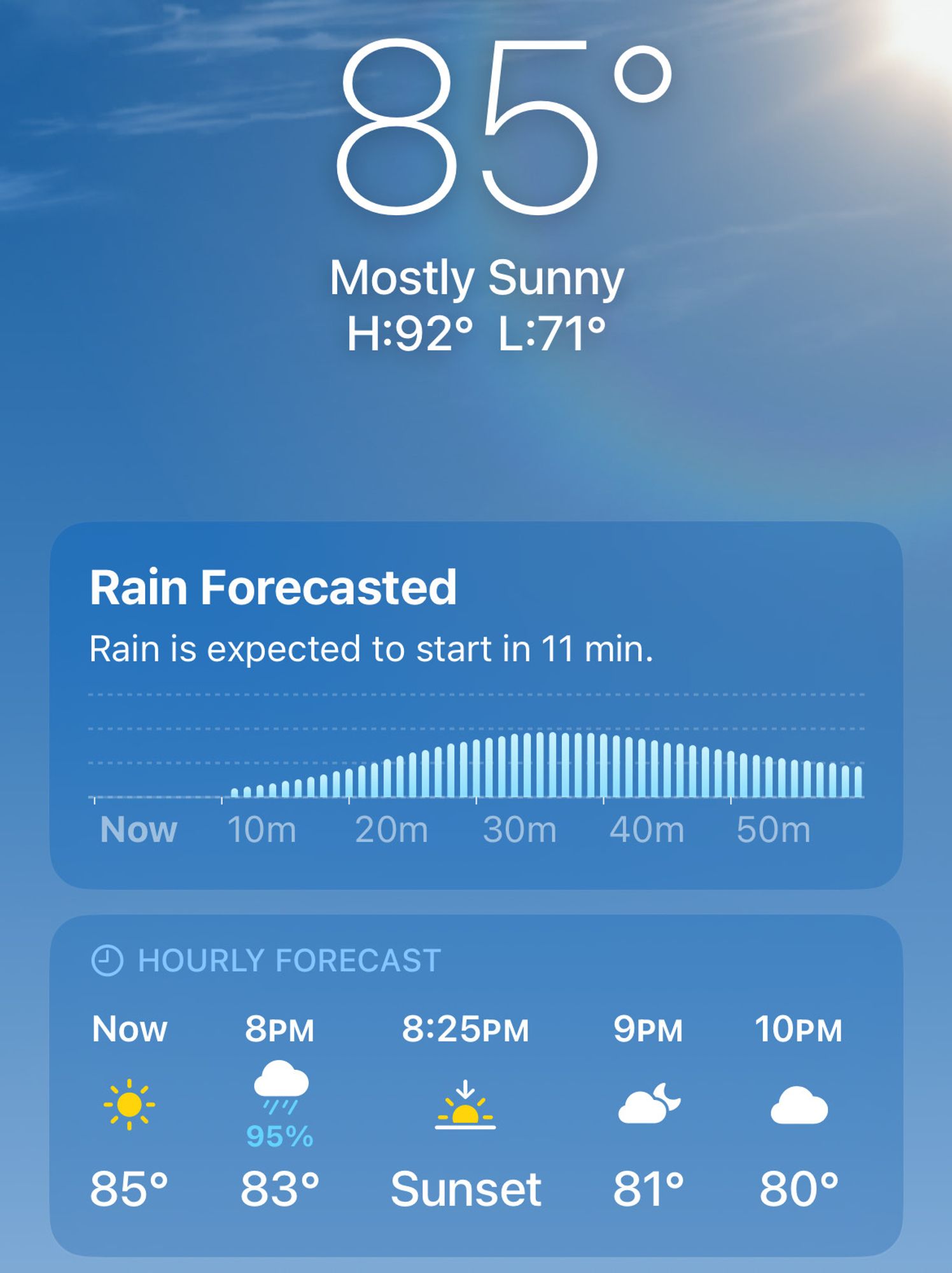 Screenshot of a weather app showing the current temperature is 85 degrees F and rain is forecasted to start within a few minutes.