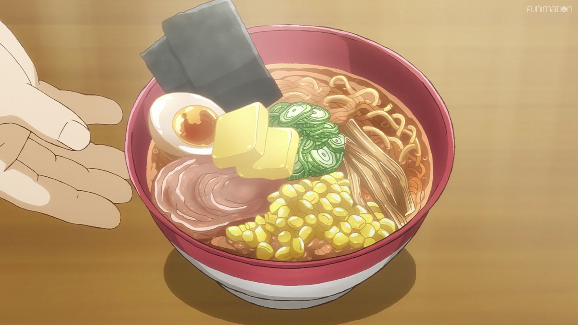 Anime screencap from Ikebukuro West Gate Park: A bowl of ramen topped with seaweed, green onions, egg, corn, bamboo, chashu, and butter.