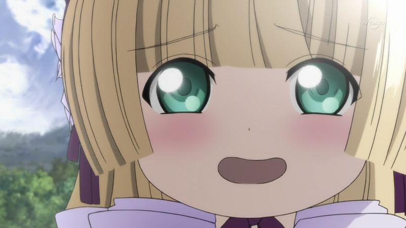 Anime screencap: Victorique from GOSICK. A young girl with blonde hair and wide green eyes smiles at the camera with joy.