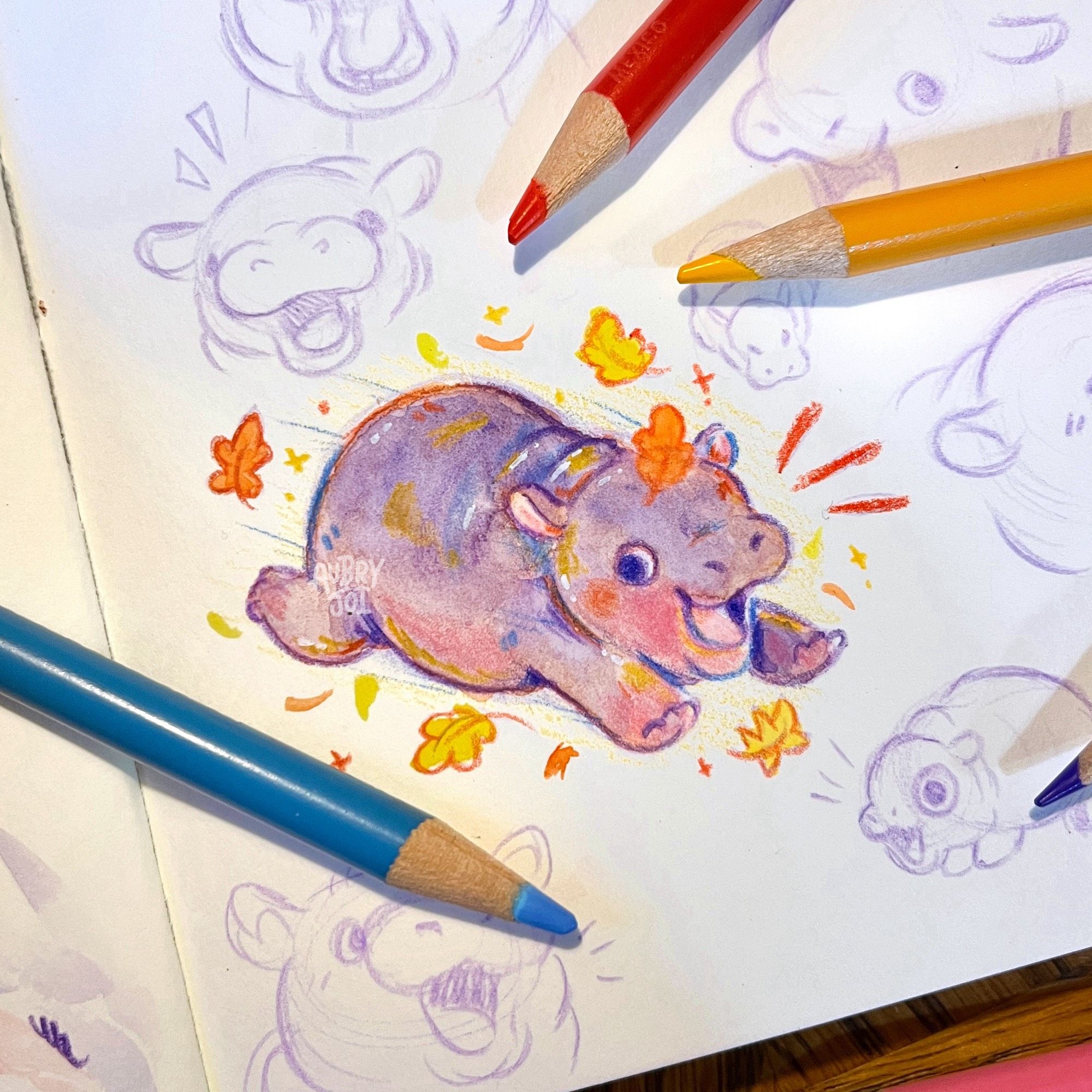 A watercolor painting of Moo Deng, the baby hippo. She is running through some fall leaves. She’s got some fun colors used on her, like blue & orange. She’s in a sketchbook and surrounded by other pink pencil sketches of herself.