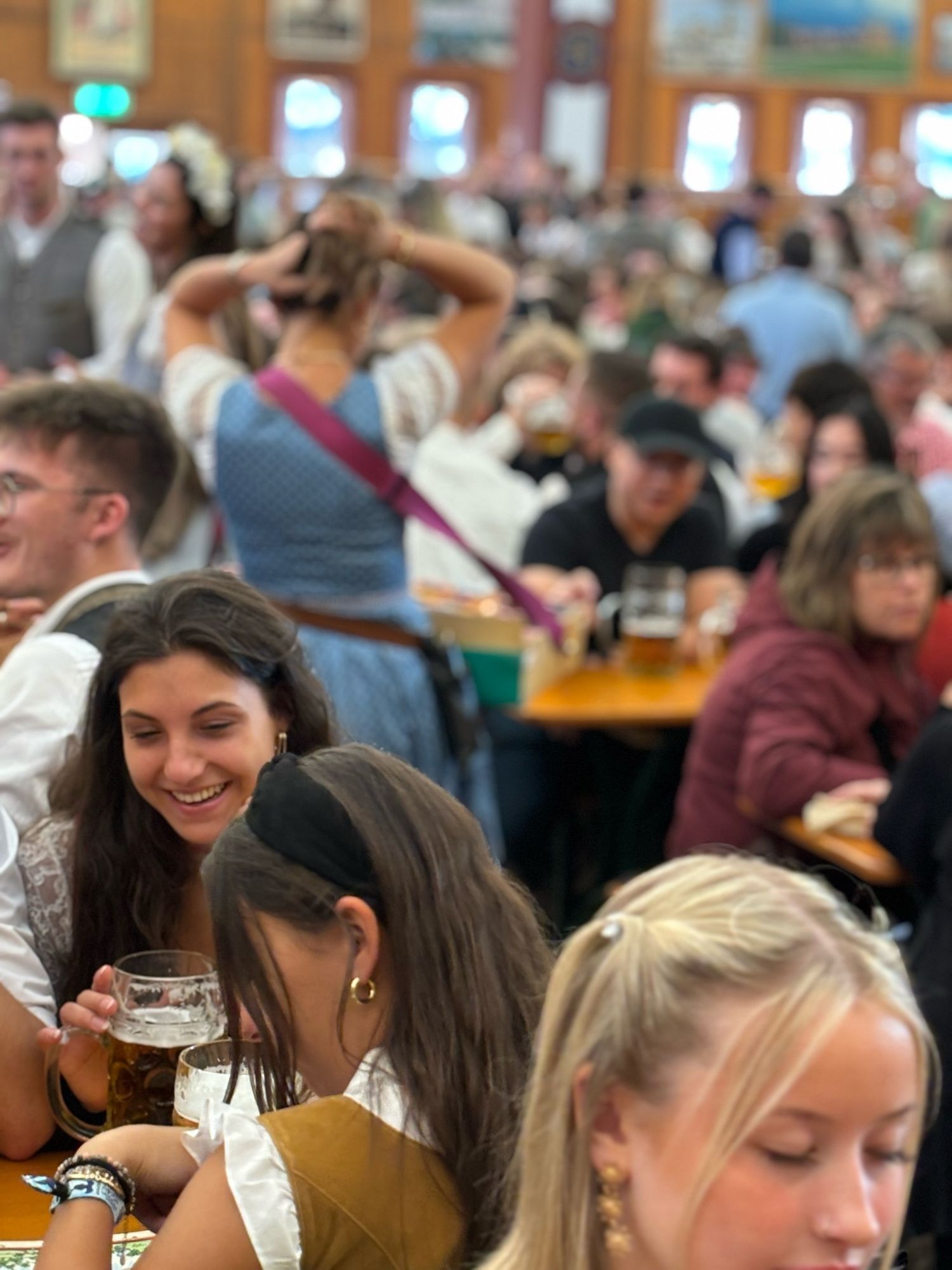 A girl smiles in a beer tent