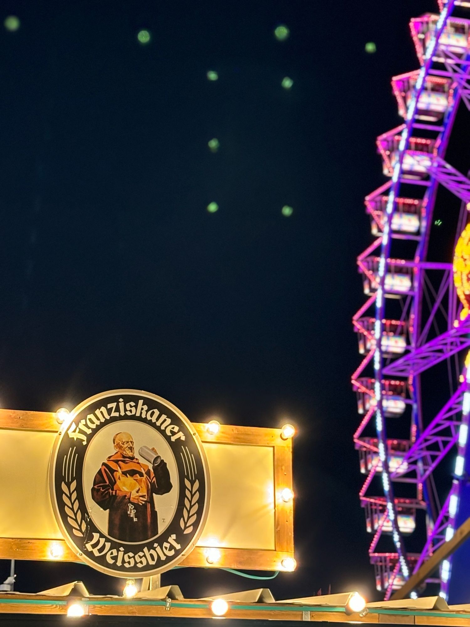 Arty shot of Frankiskaner logo with big wheel in background