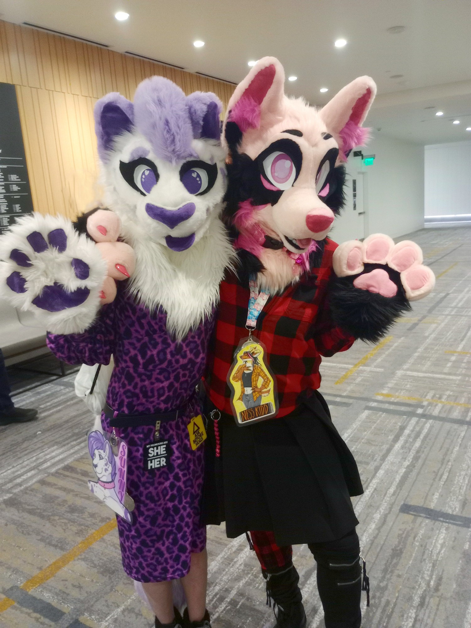 A snep in her purple spotted dress and a cute pink puppy in a red flannel shirt and black skirt pose for a pic at ANW.