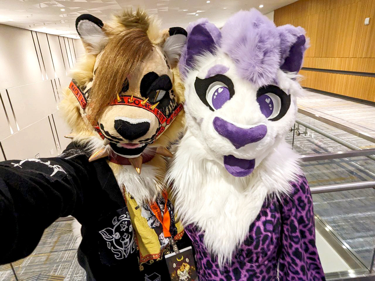 Two spotted kitties, a cheetah and a snep pose for a pic at ANW