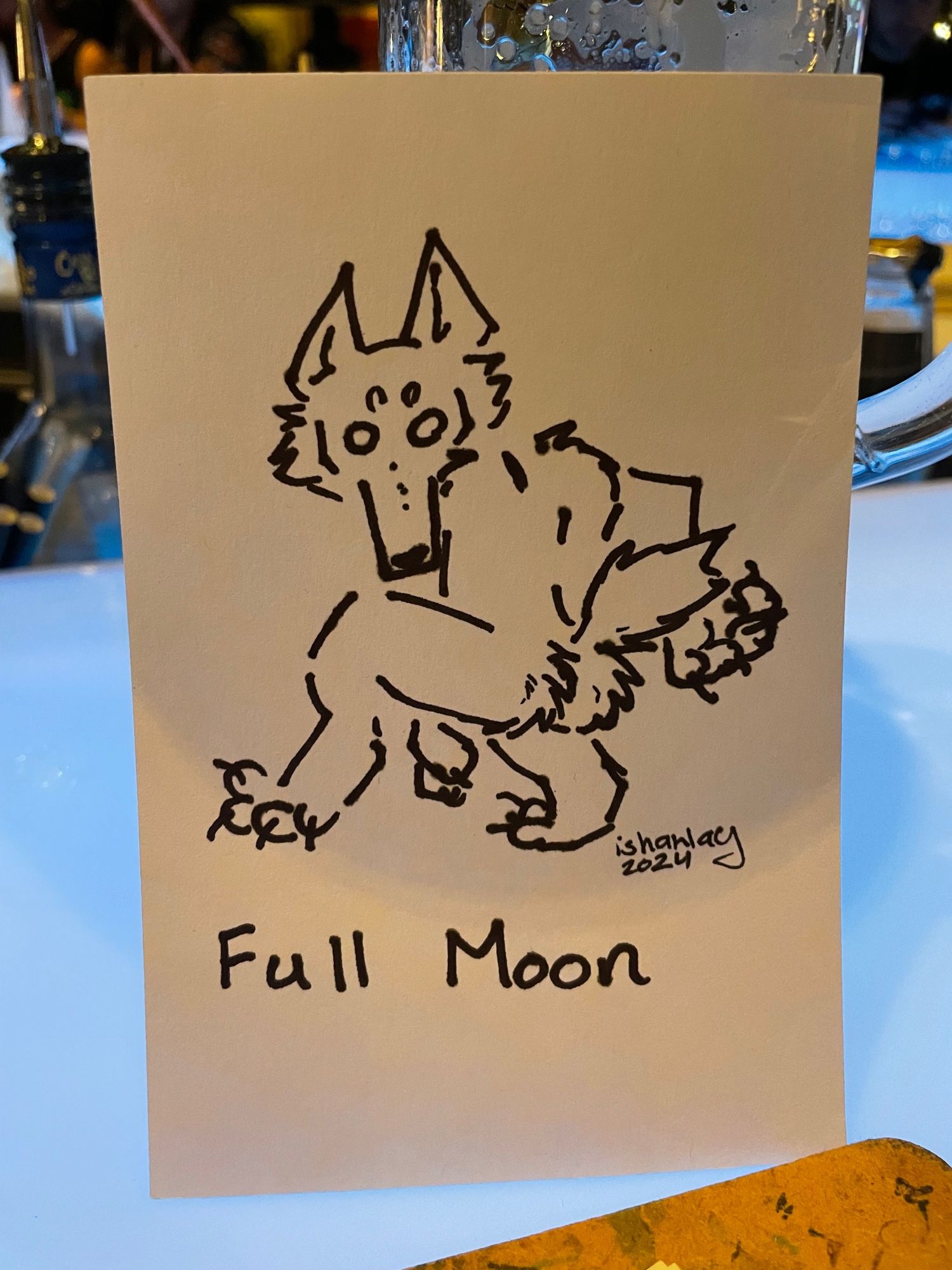 A cartoonishly bad drawing of a werewolf double caked up on a Thursday afternoon with the text Full Moon under it.