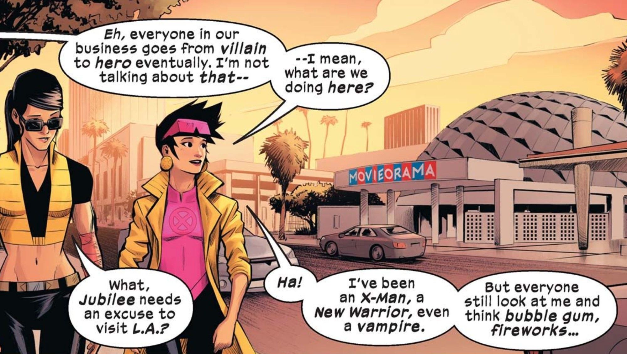 Jubilee and Lady Deathstrike walk by the Marvel Universe version of the Cinerama Dome in Hollywood. Jubilee mentions she's been an X-Men, a New Warrior, even a vampire.