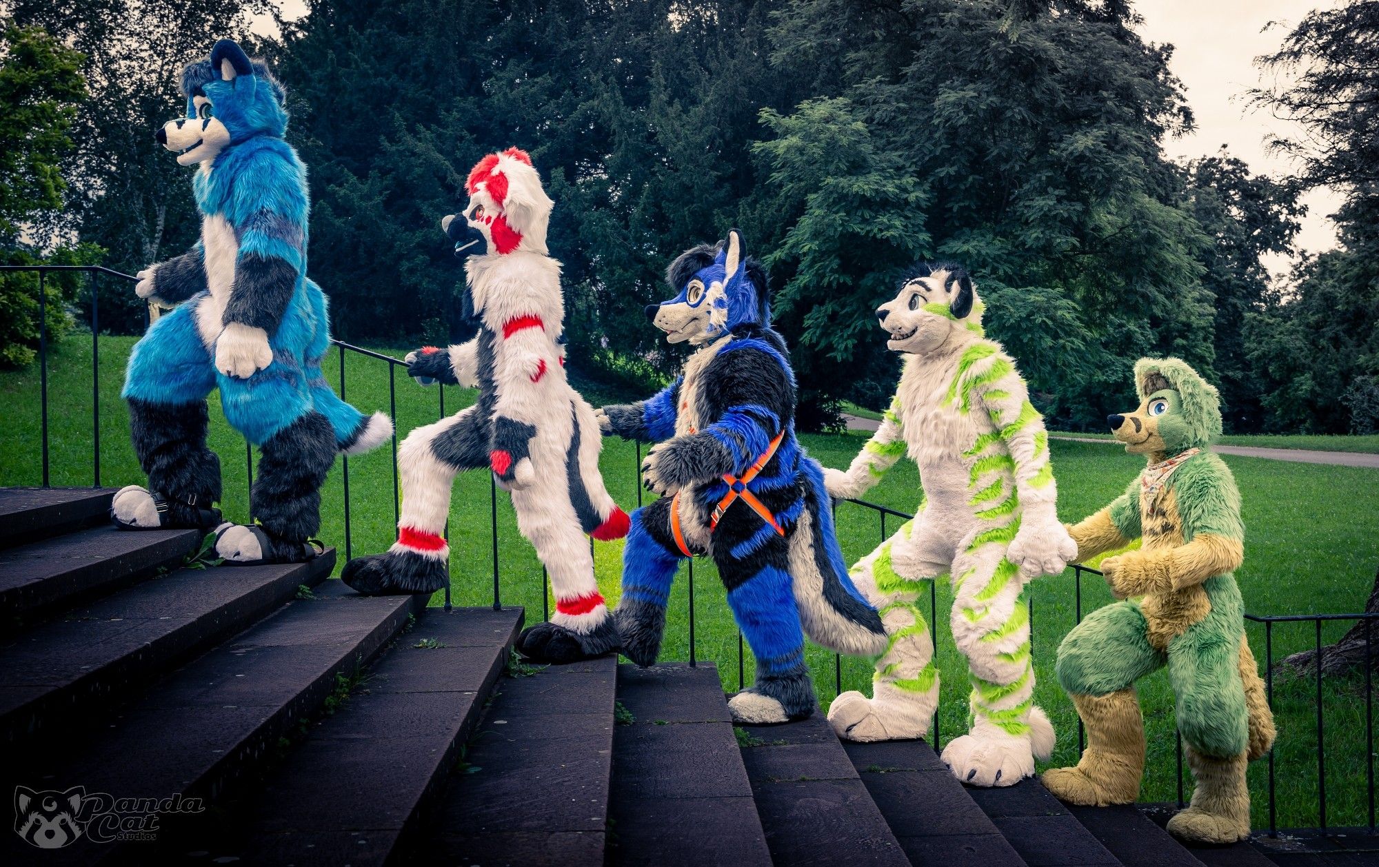 Fursuits walking up stairs, posed somewhat like the Battles album cover from the Abbey Road album.