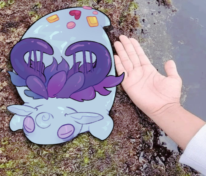 a drawn over image of a rather fat Cherubble from My Singing Monsters next to an actual human hand, the original image was taken somewhere near a tide pool.