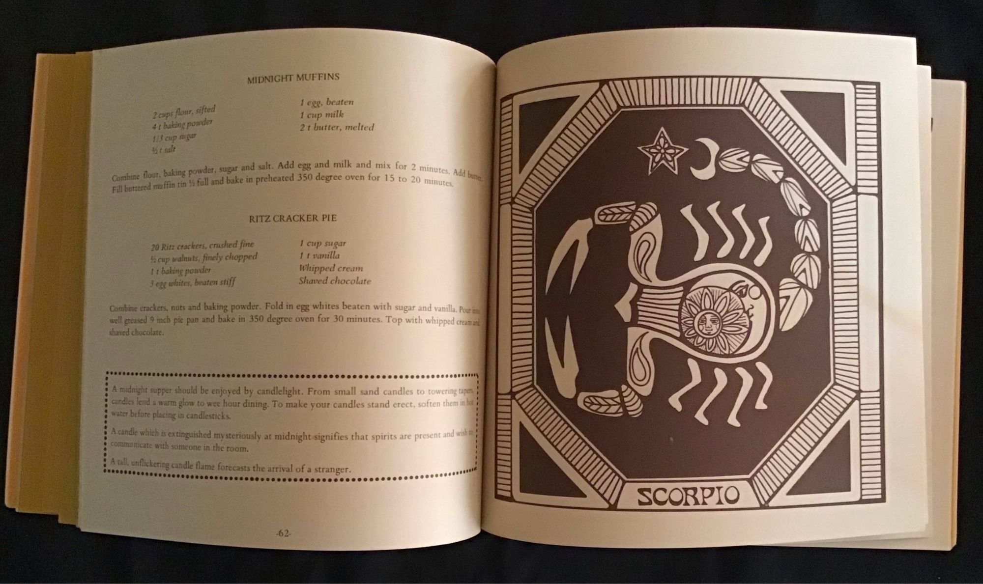 Zodiac cookbook opened to Scorpio page with recipes and a graphic of a scorpion.