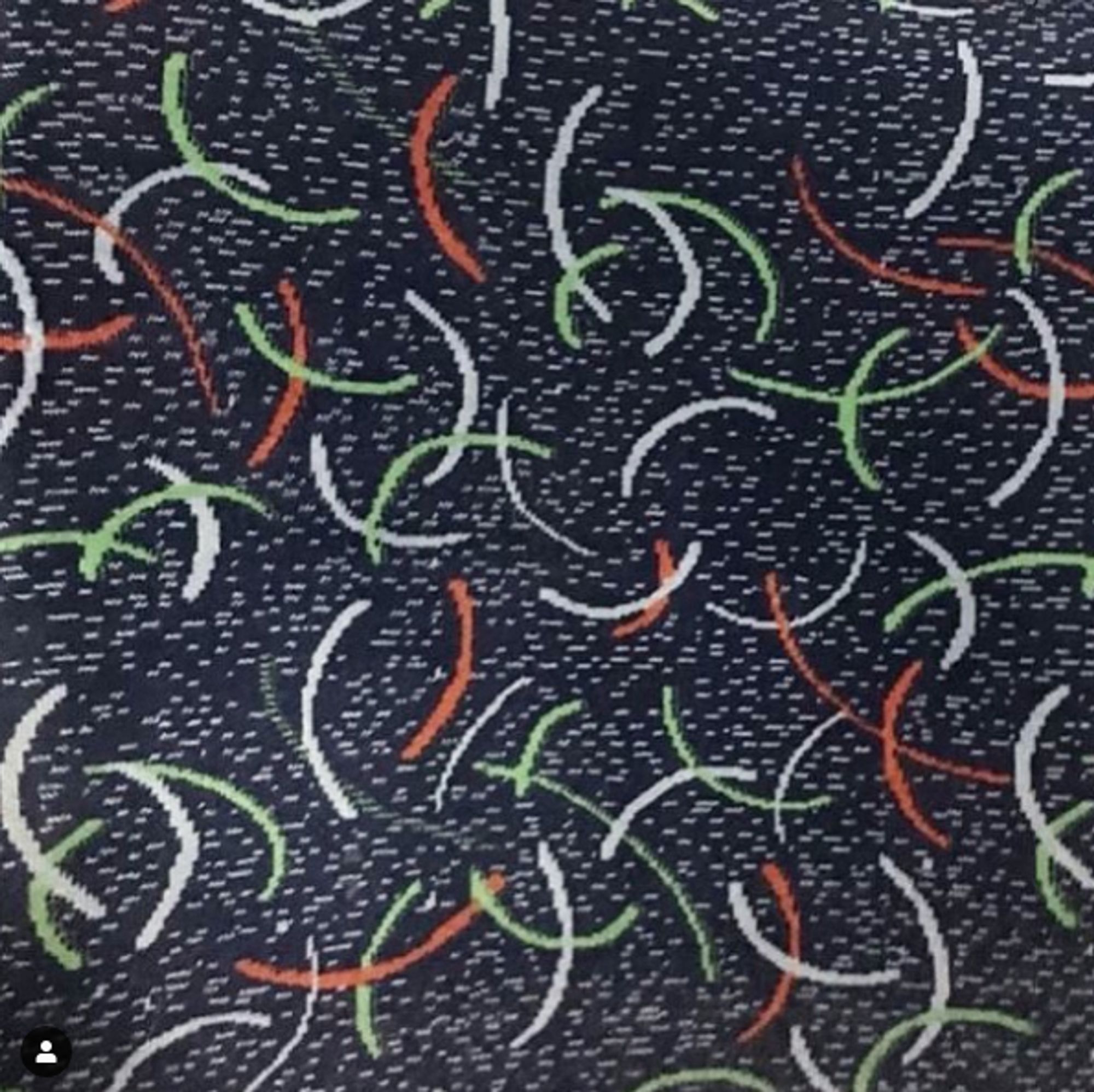 Un motif de siège de transports en commun à arc de cercles verts oranges et blancs