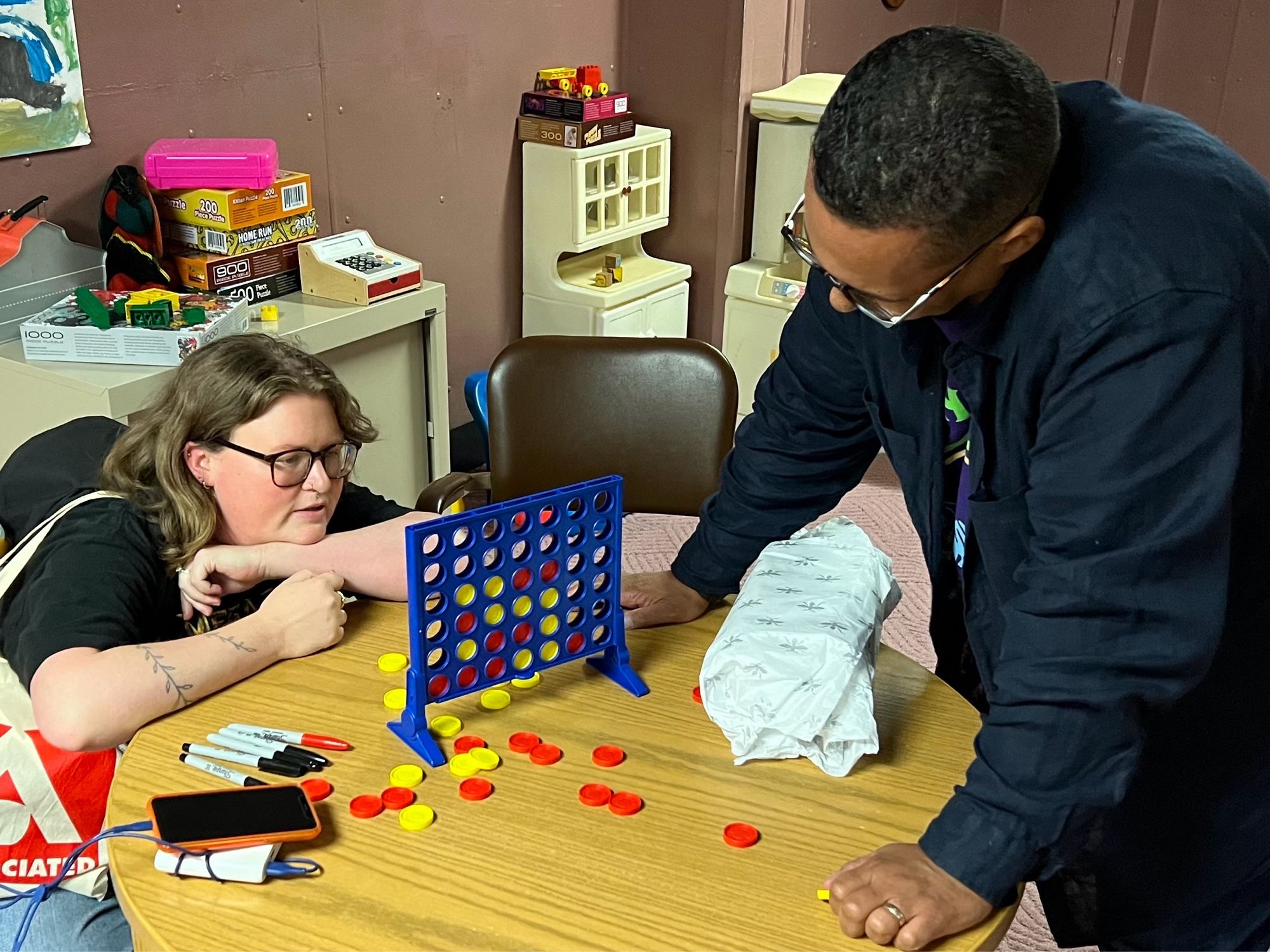 Two brilliant people play Connect 4 while making a TV show.