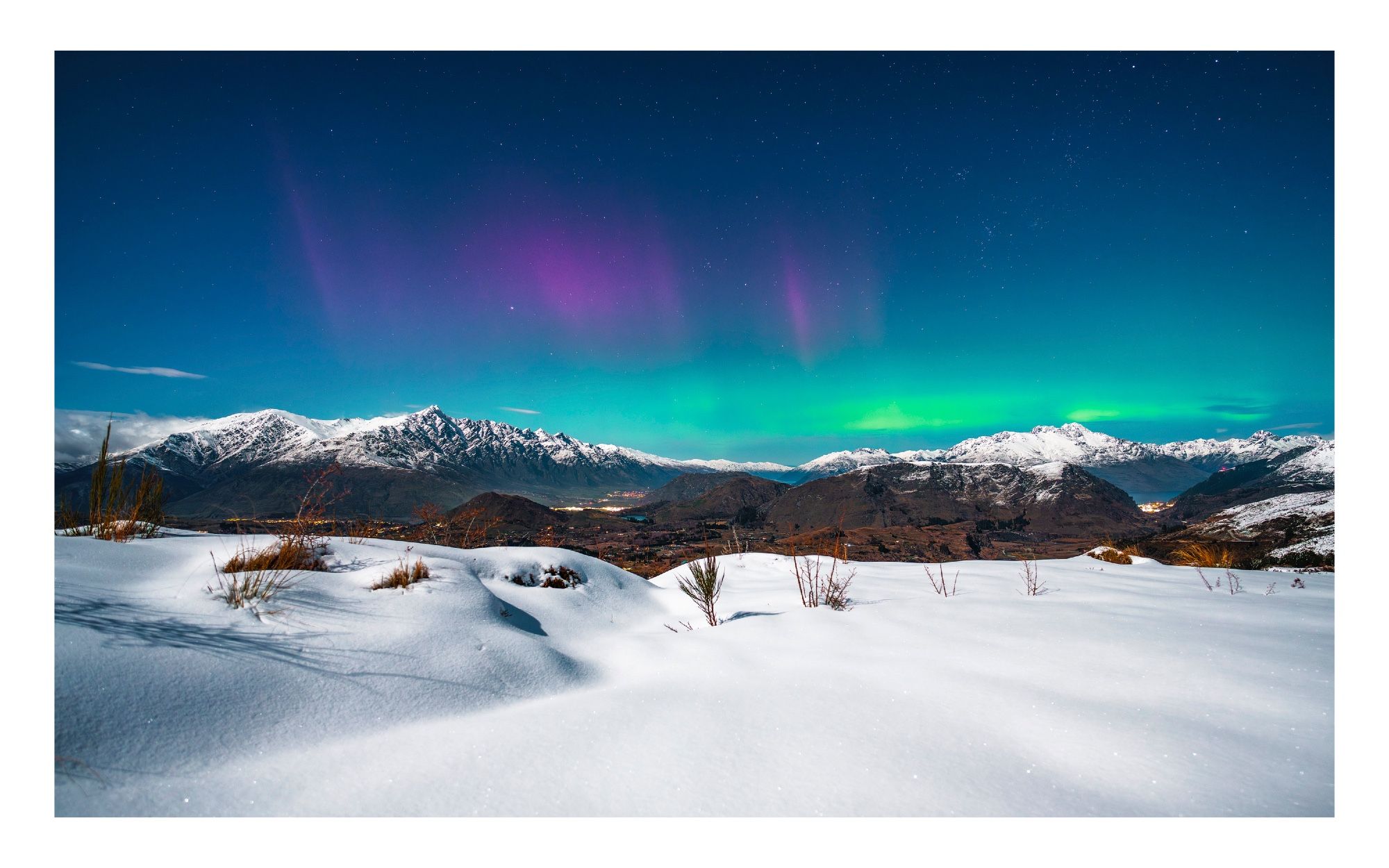 Aurora over the Queenstown valley with lots of fresh new snow