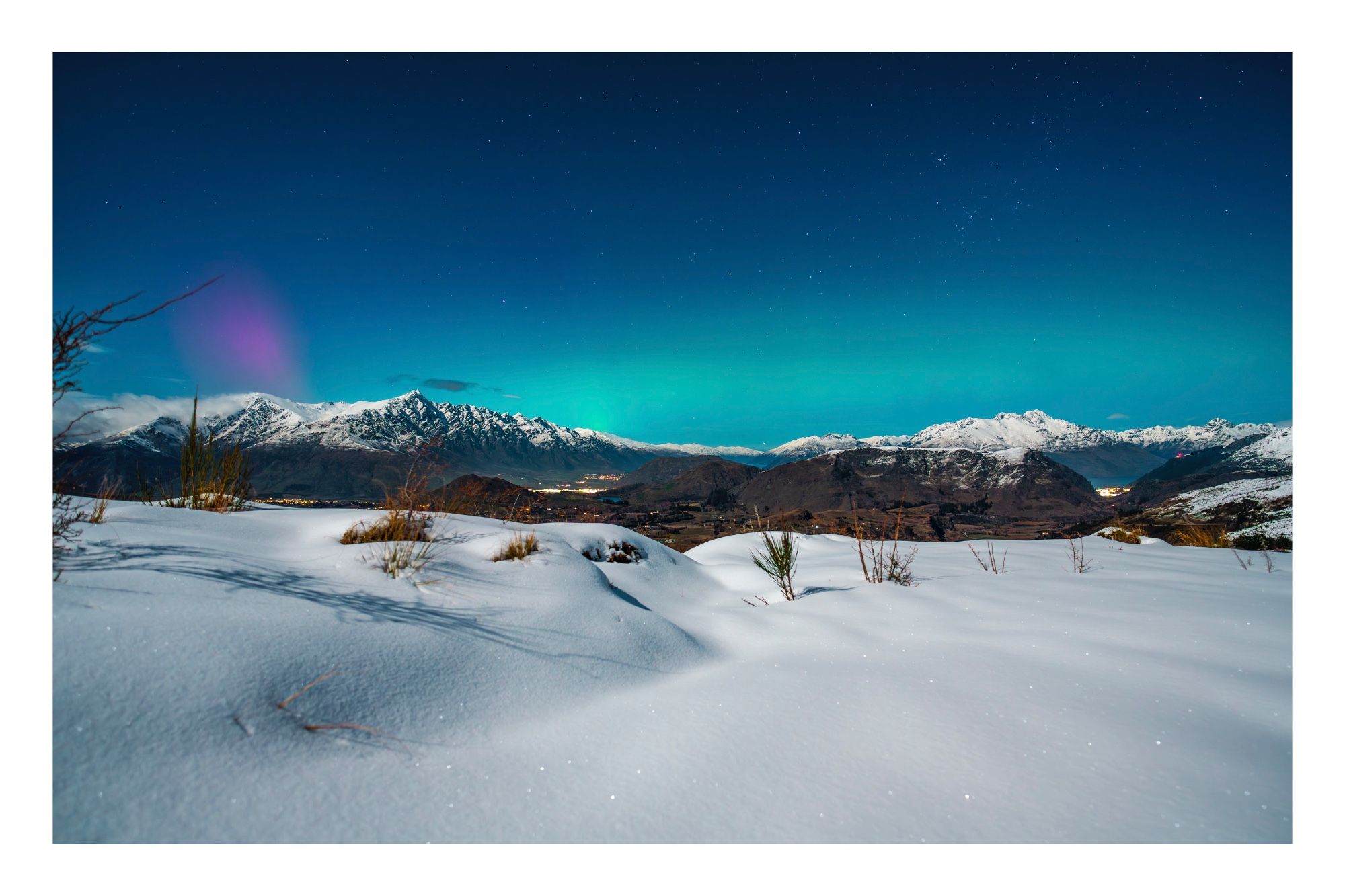 Aurora over the Queenstown valley with lots of fresh new snow