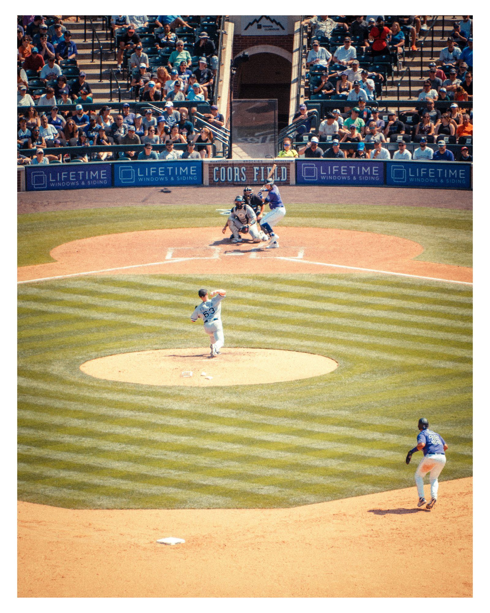 This was the 2nd day of trying out my new camera, the Nikon Z7ii 45megapixel mirrorless beast.  With my 28-300mm lens, even at 500ft away I was able to zoom in to the action of the running leading off from 2nd base, a pitcher about to release the ball & the batter poised.  Crowd in the back ground