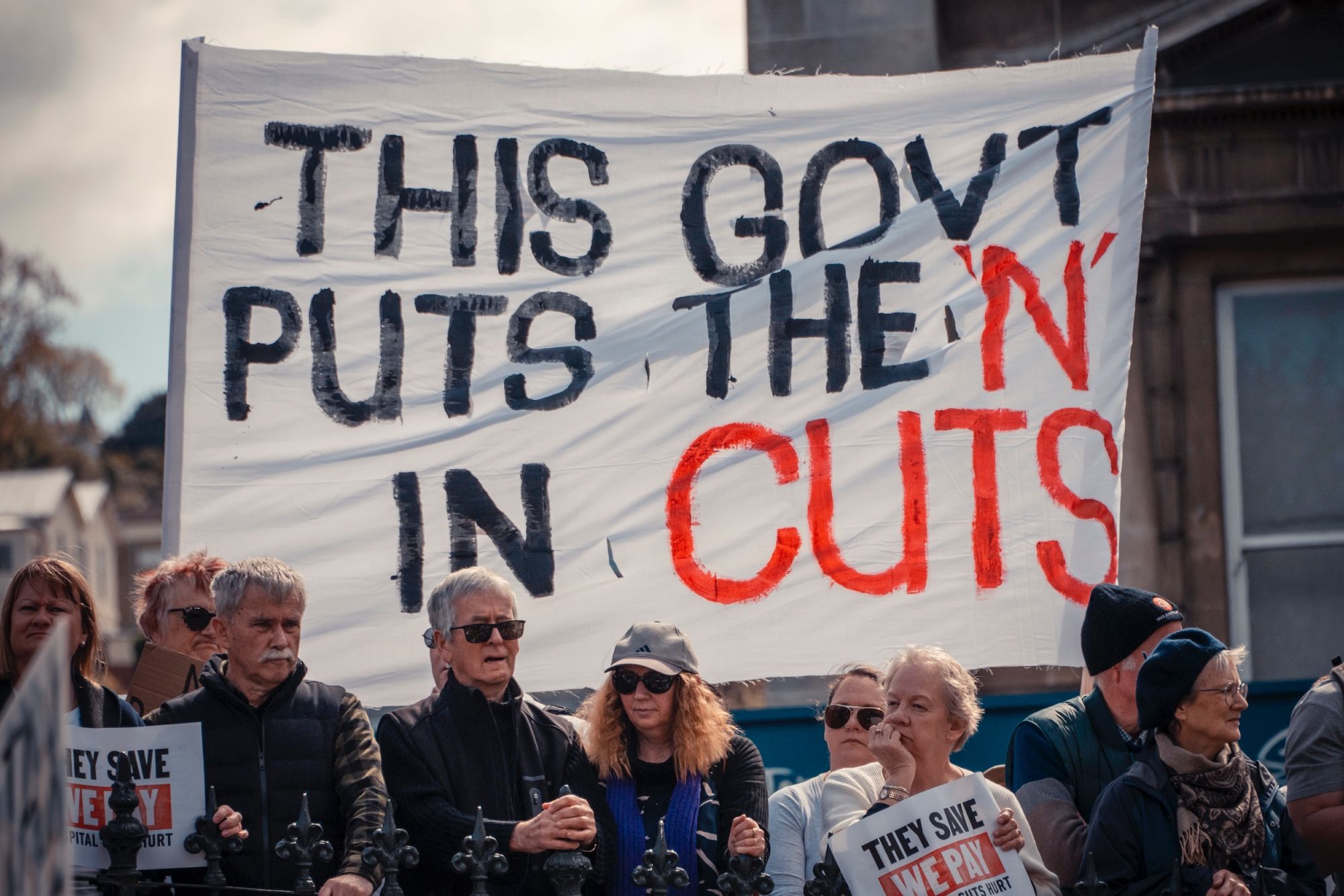 Sign reads 'This Govt puts the  N in Cu ts'