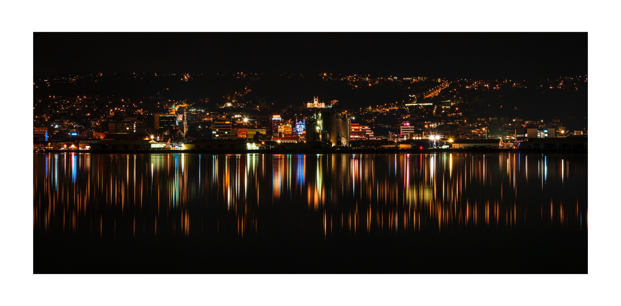 In this picture is 1st Church (historic Presbyterian church), St Paul's Cathedral in the Octagon (blue lit building), Port Otago silos, Otago Boy's High School old 'castle' building on the hill & the Stuart Street heading up to Rosslyn 