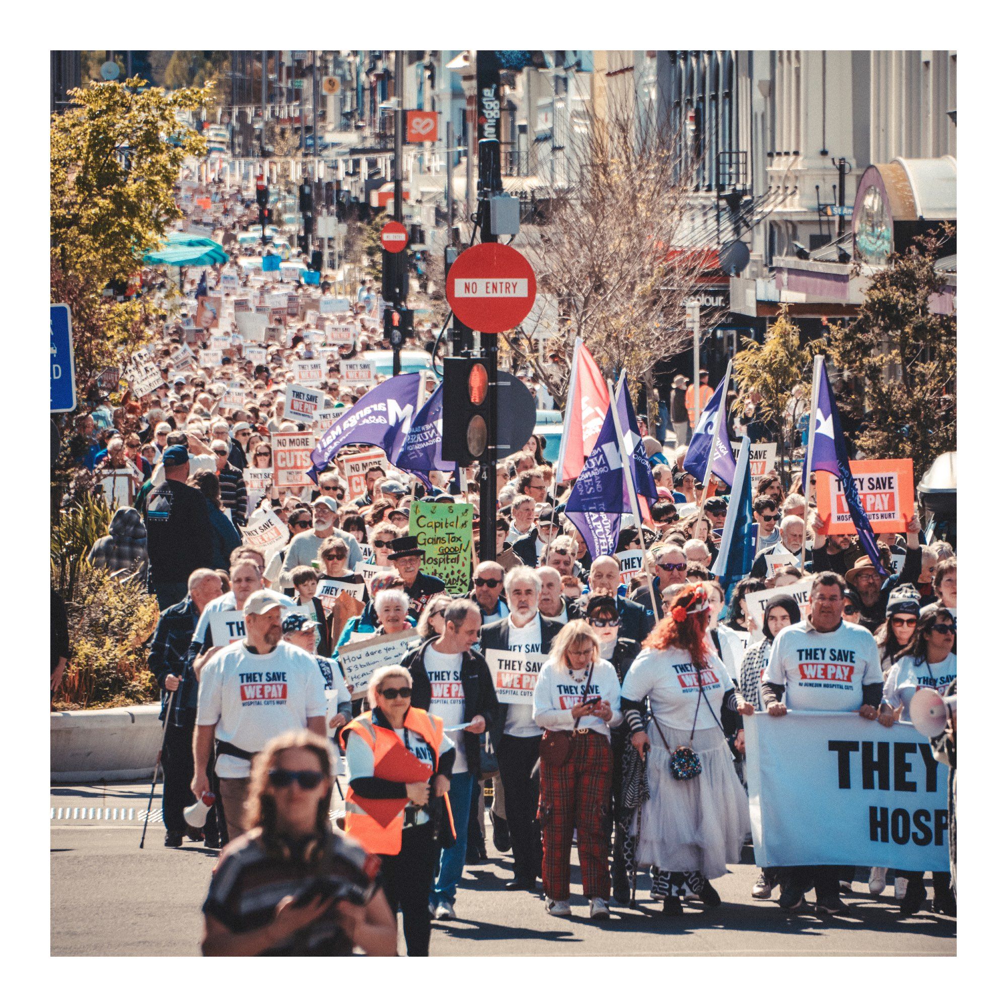 A view down George St, Dunedin in which 35,000 people marched against the heartless asshole govt health cuts & probably cancelling or the Dunedin Hospital rebuild.