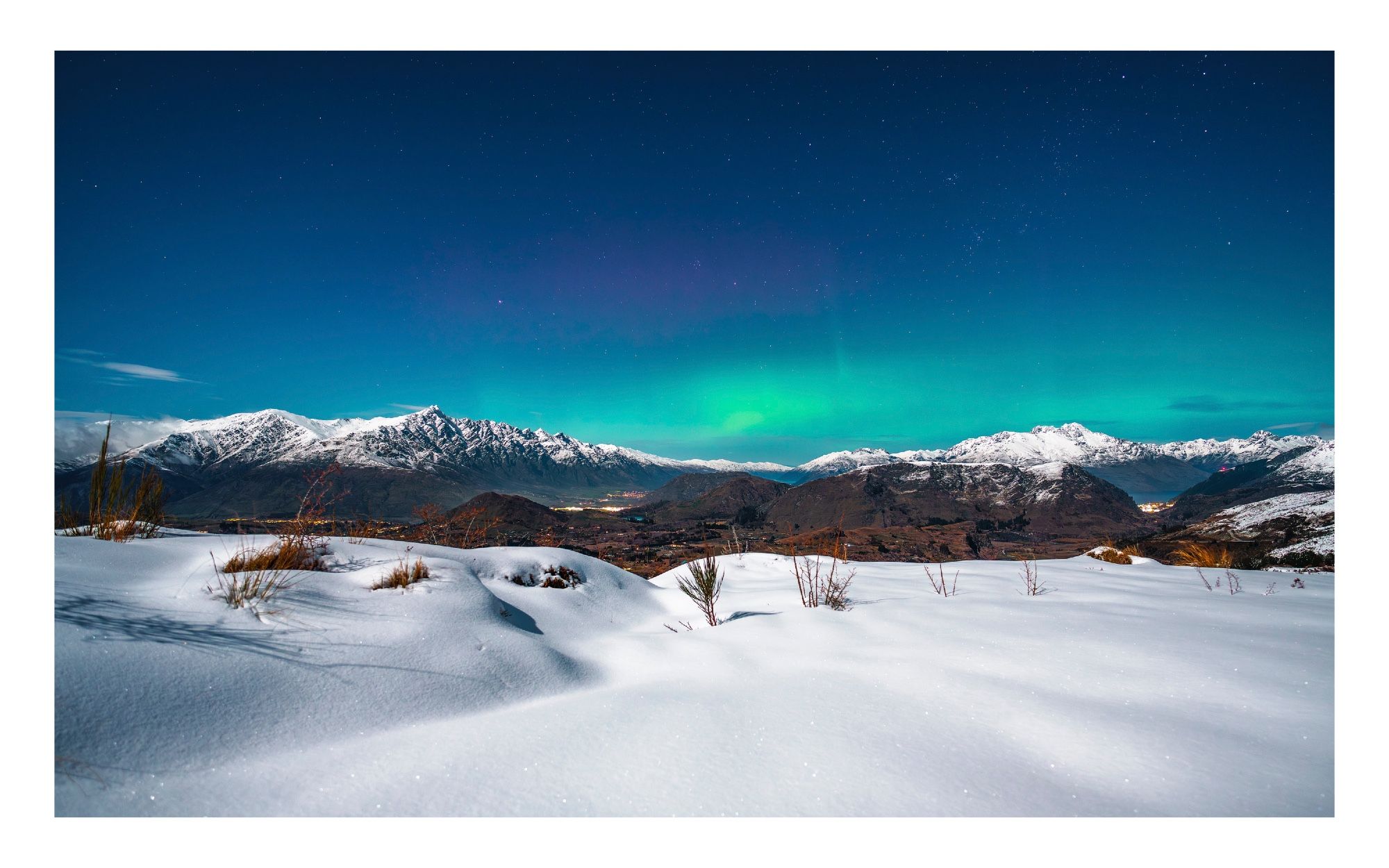 Aurora over the Queenstown valley with lots of fresh new snow